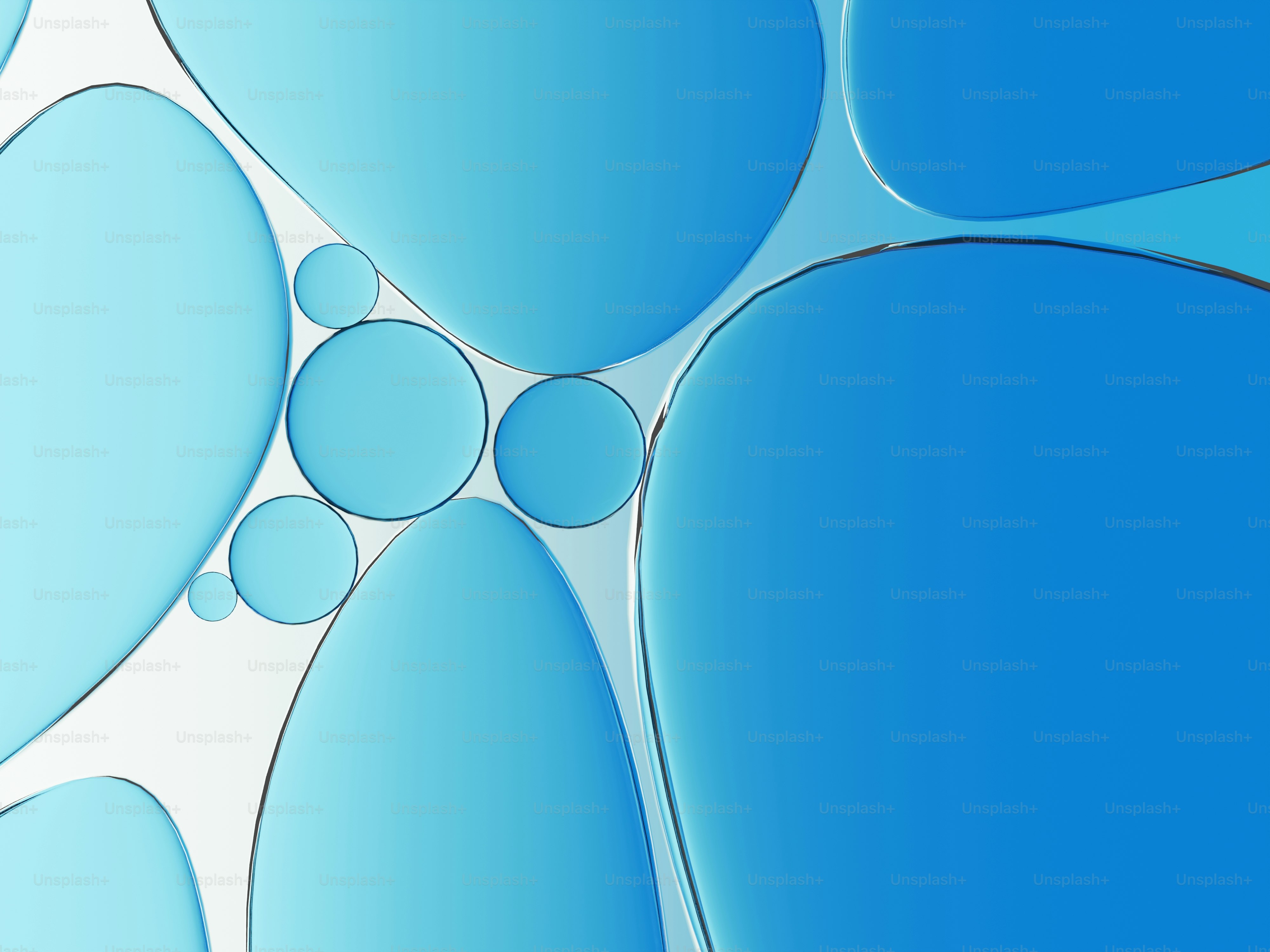 丸みを帯びた縁とさまざまな大きさの抽象的な青い形。
