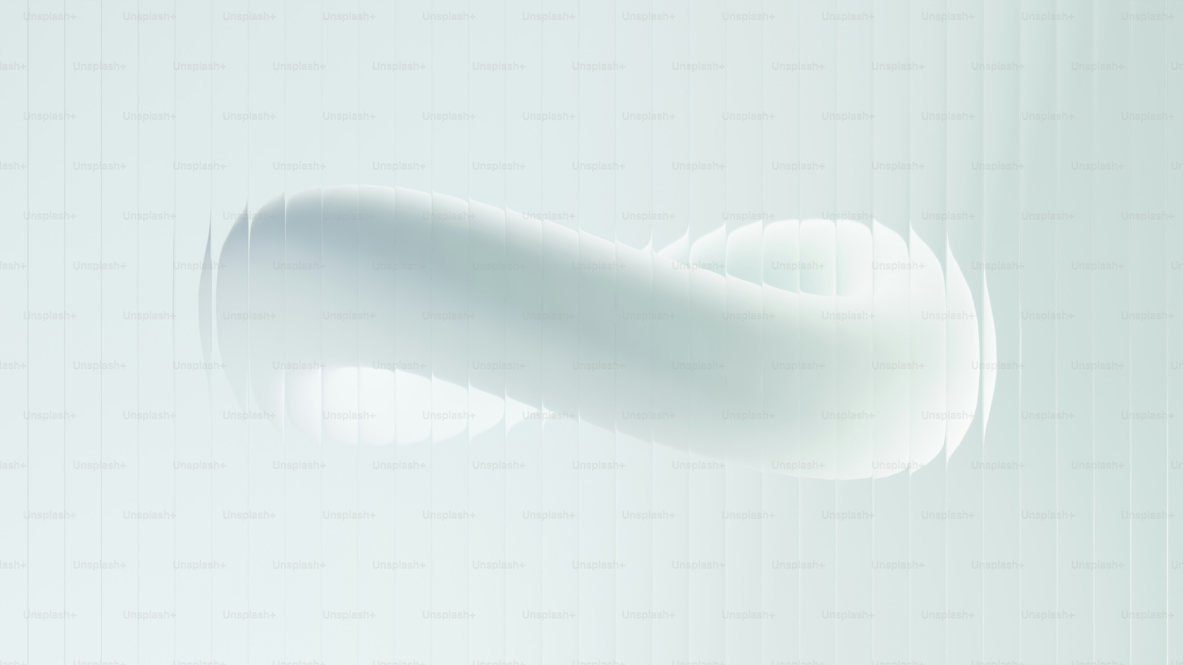 Forma abstrata de toro branco com iluminação suave