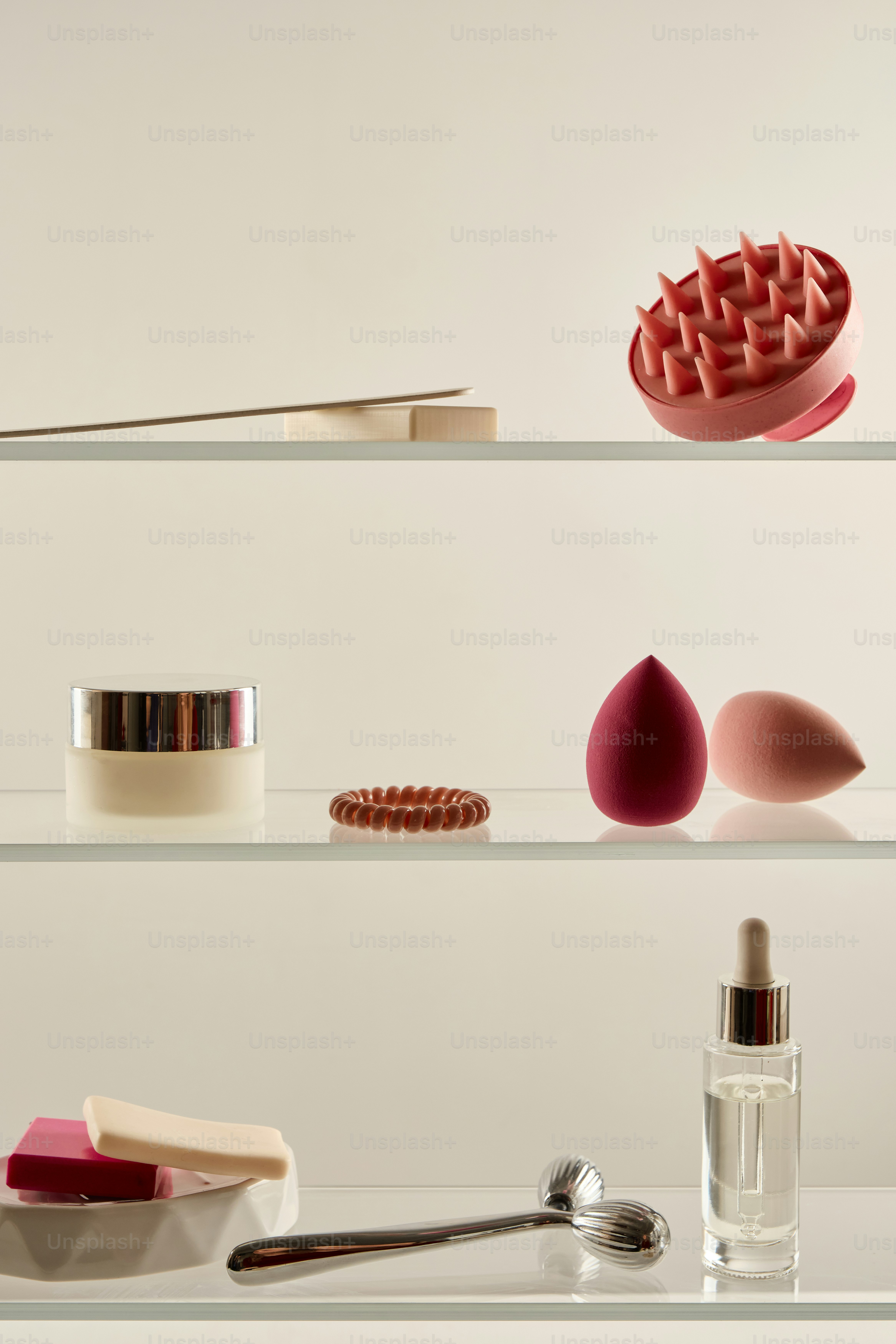 Cosmetic products and tools arranged on shelves.