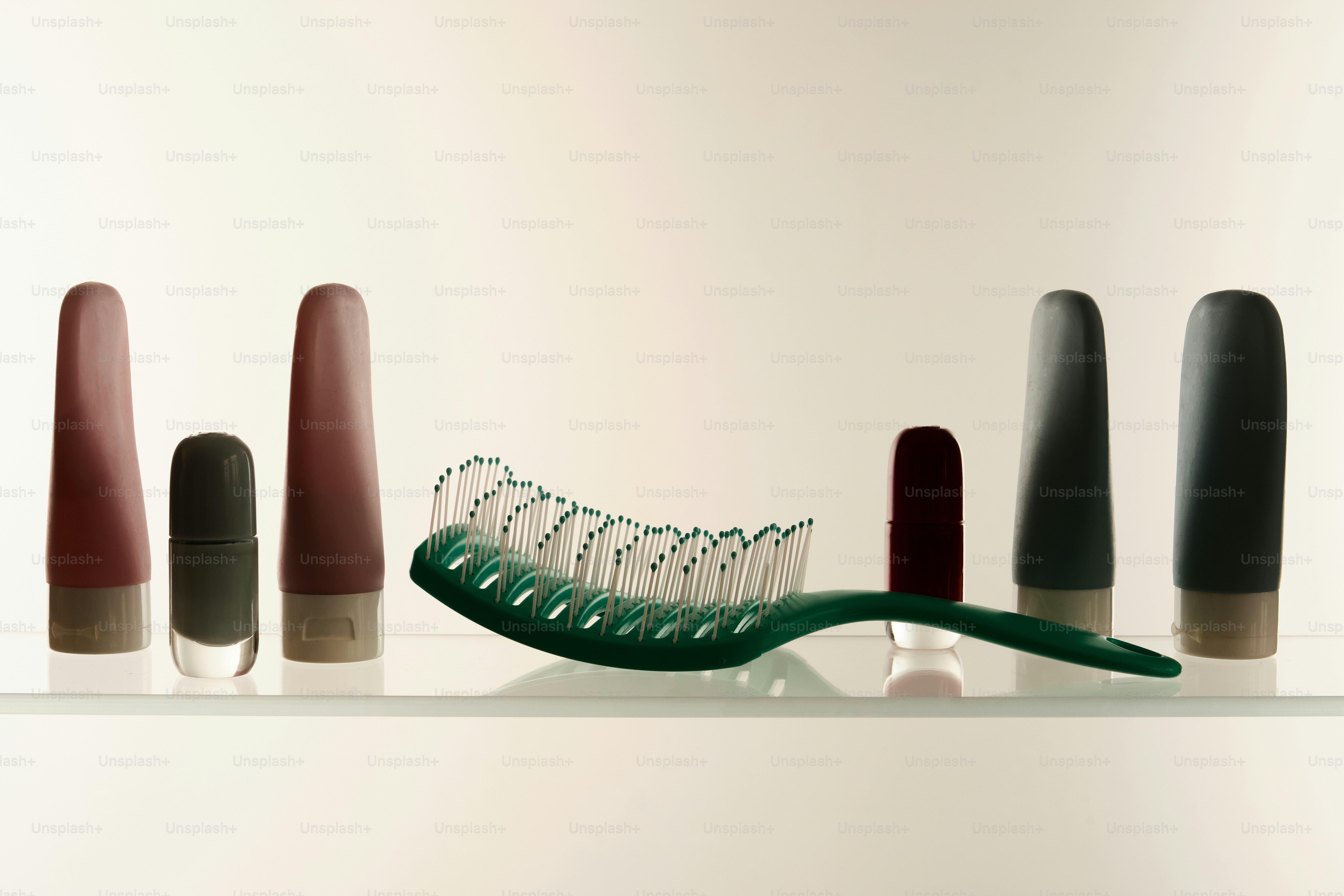 glass shelf with toiletries and everyday products