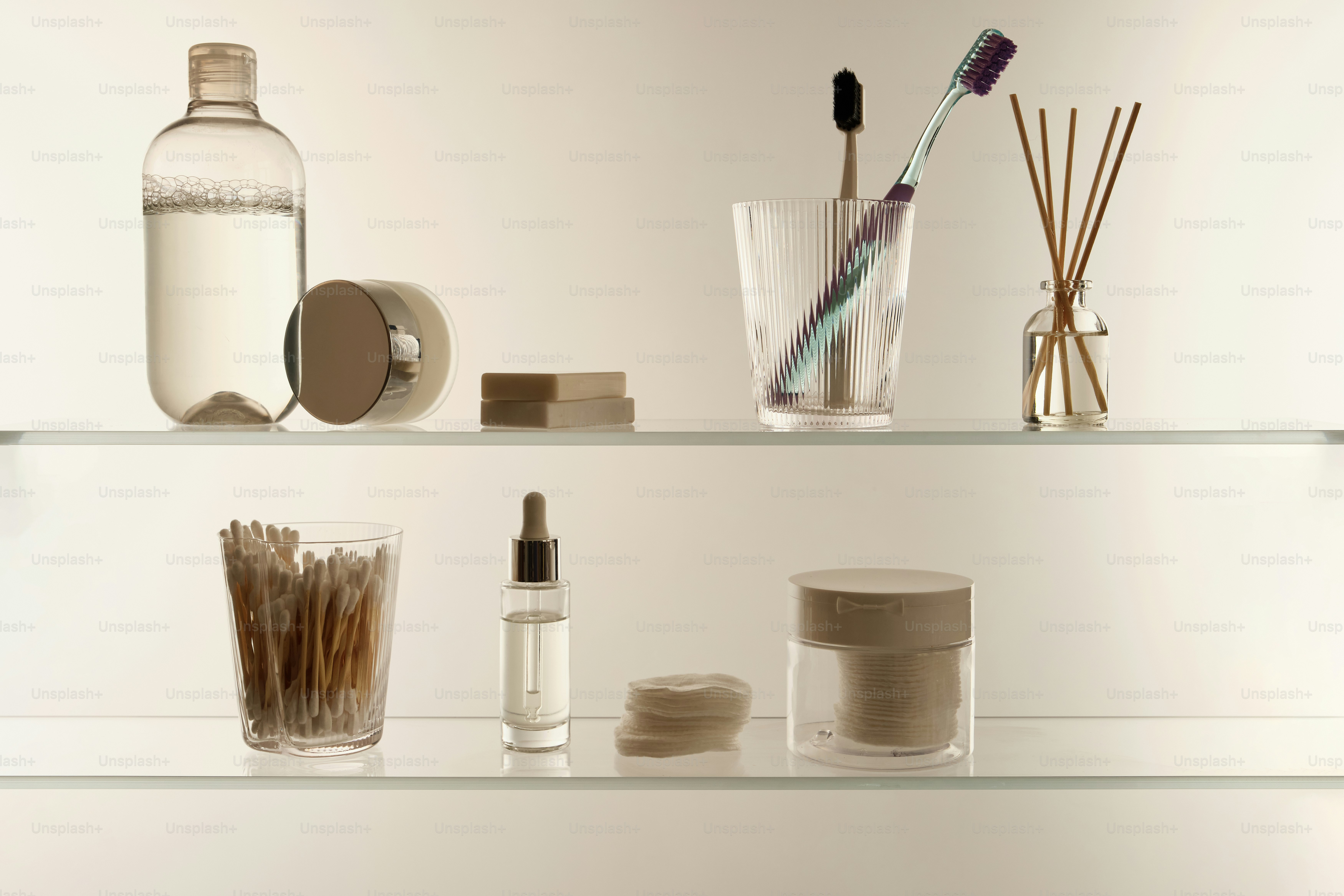 Bathroom shelf with toiletries and personal care items.