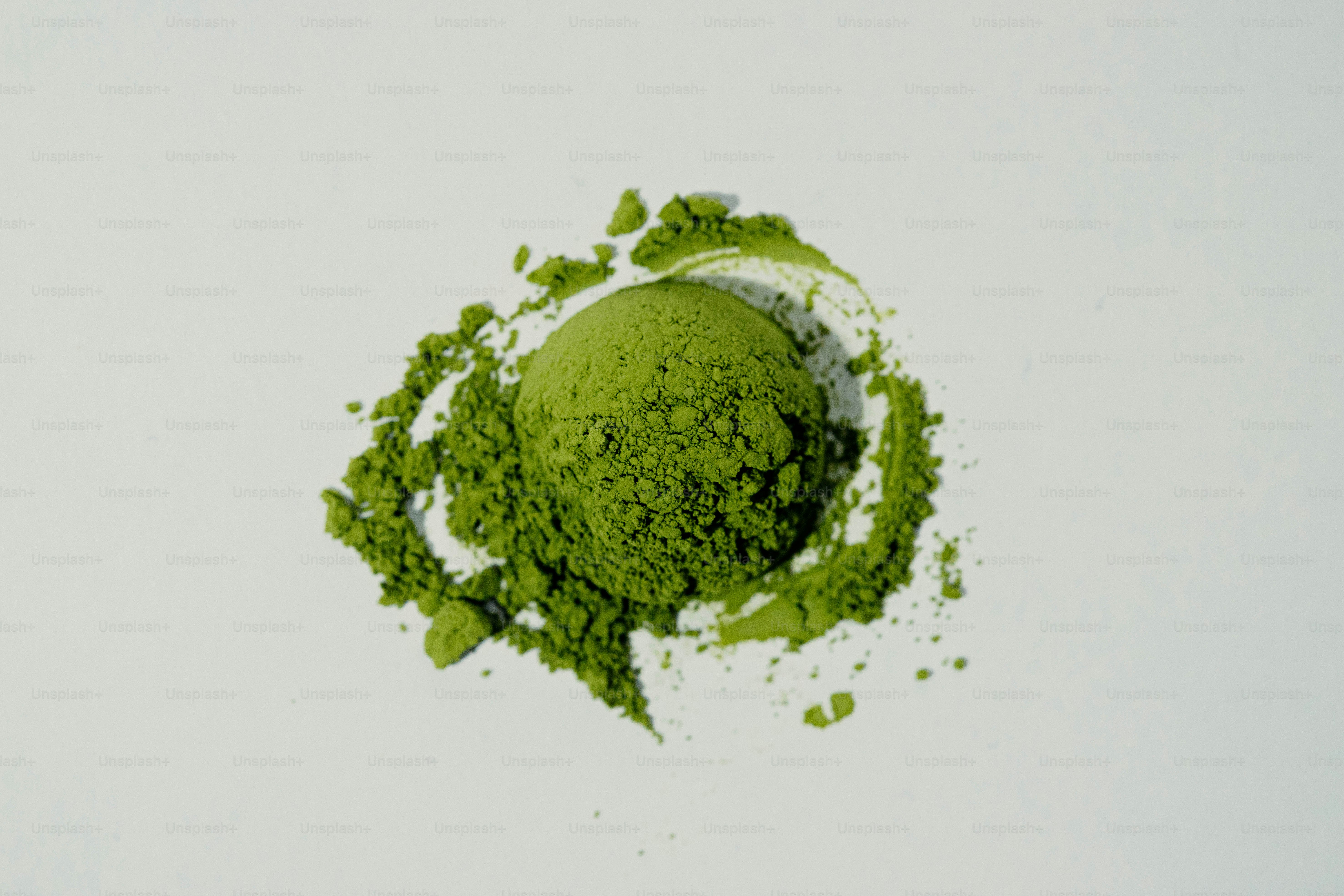 A swatch of vibrant green matcha powder on white photo – Wellness Image ...