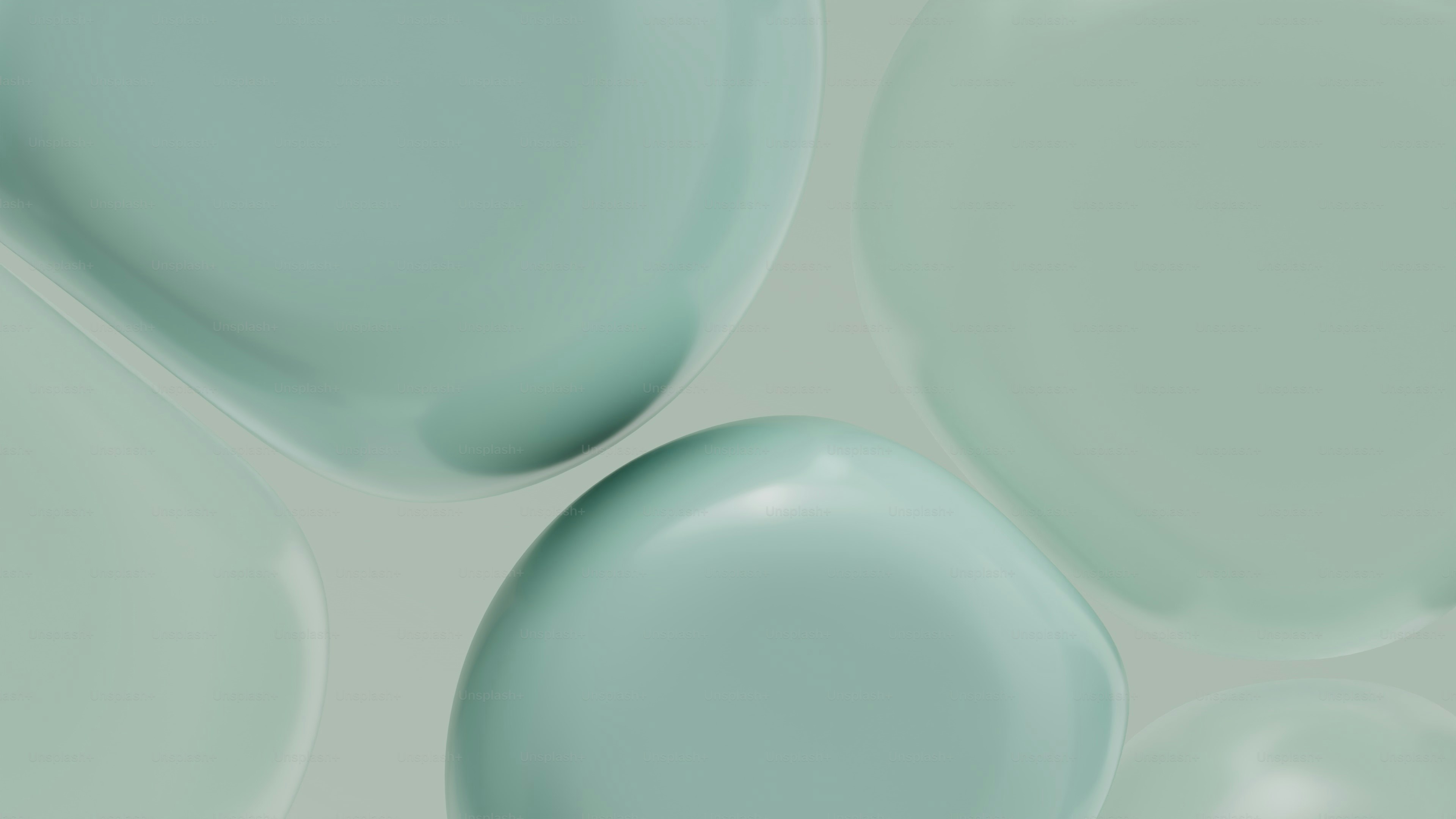 Glatte, abgerundete Formen in pastellgrünen Tönen.