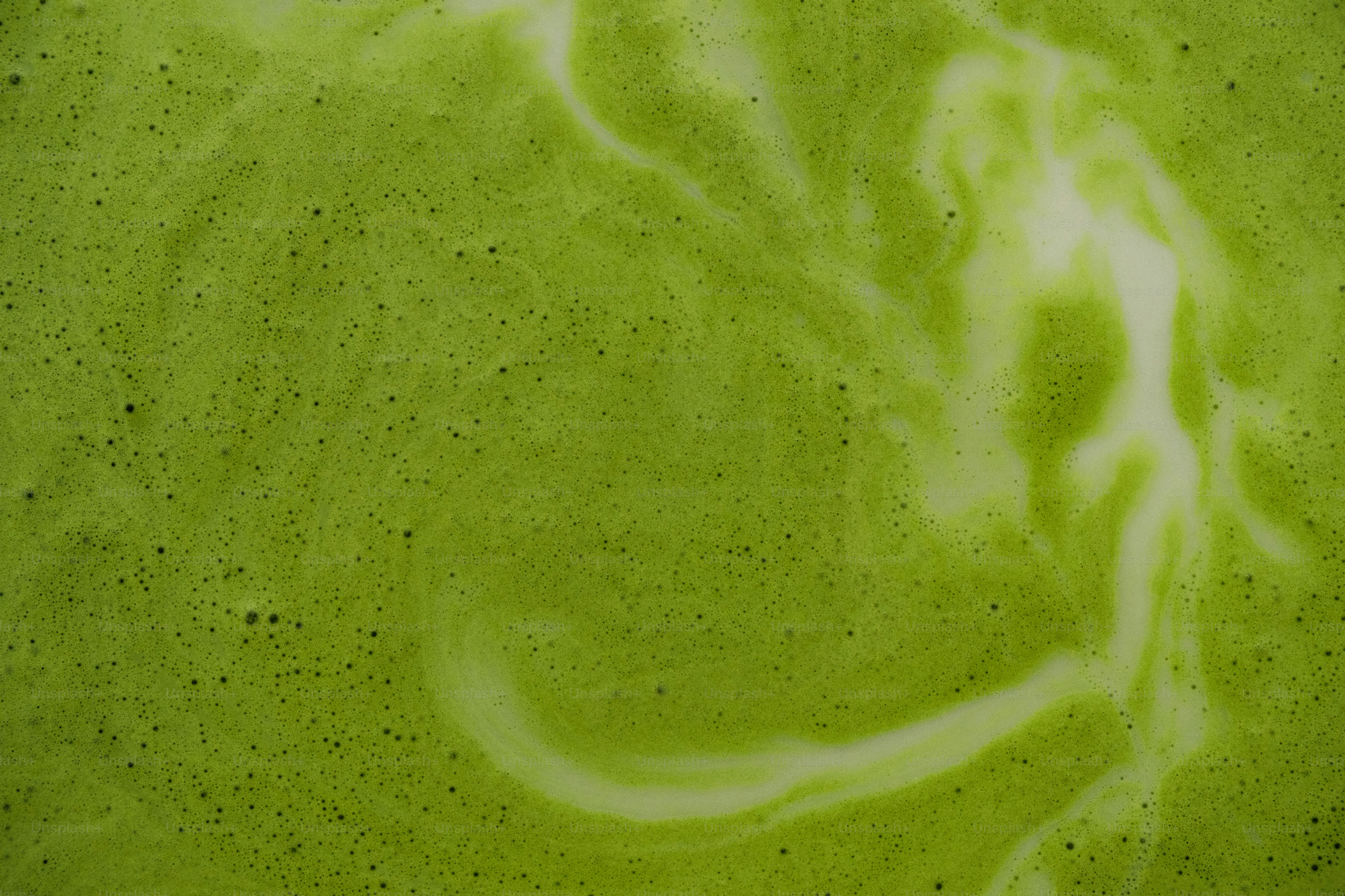 Green foamy liquid with white swirls