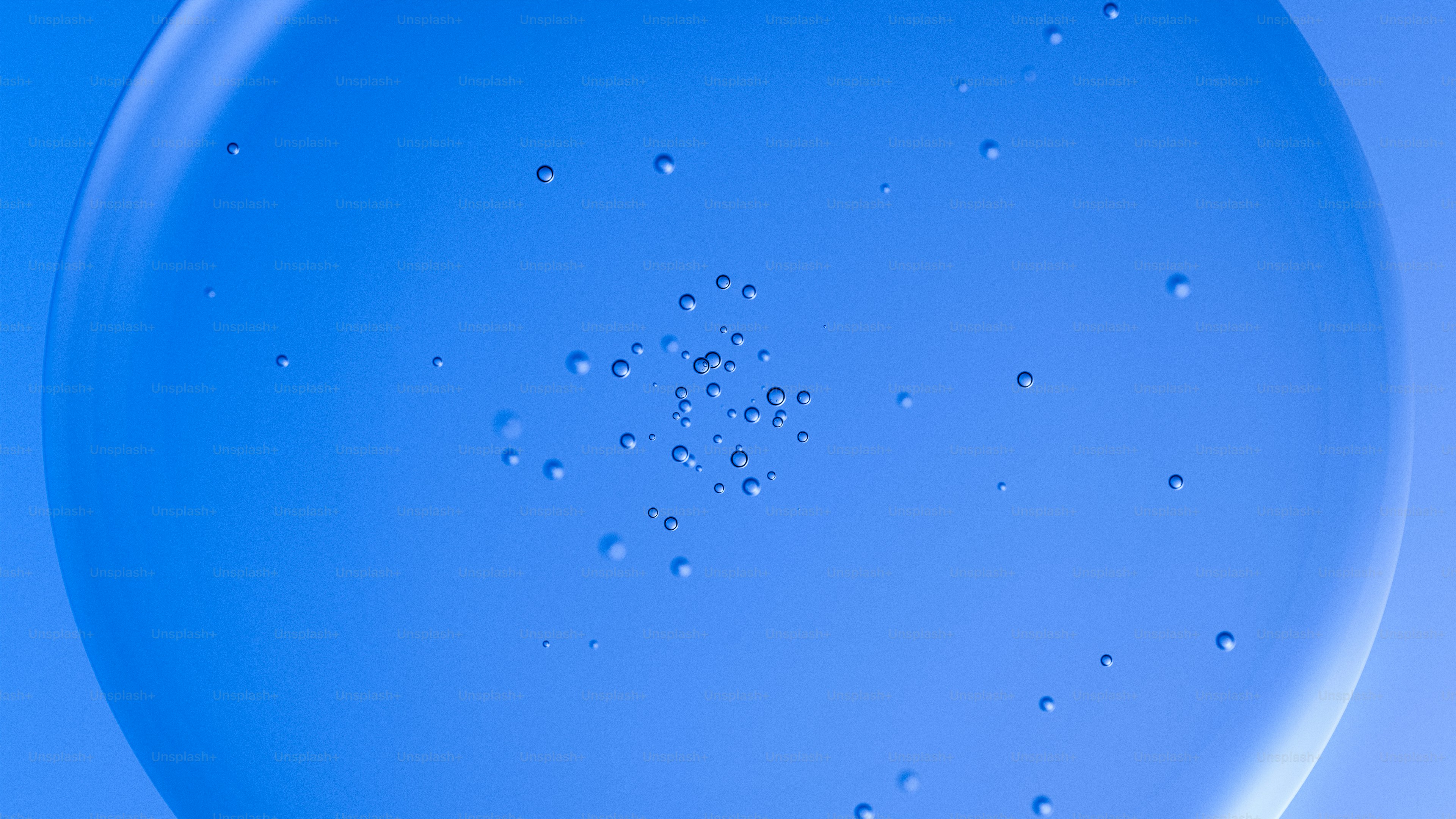 Blue liquid with small bubbles suspended within.
