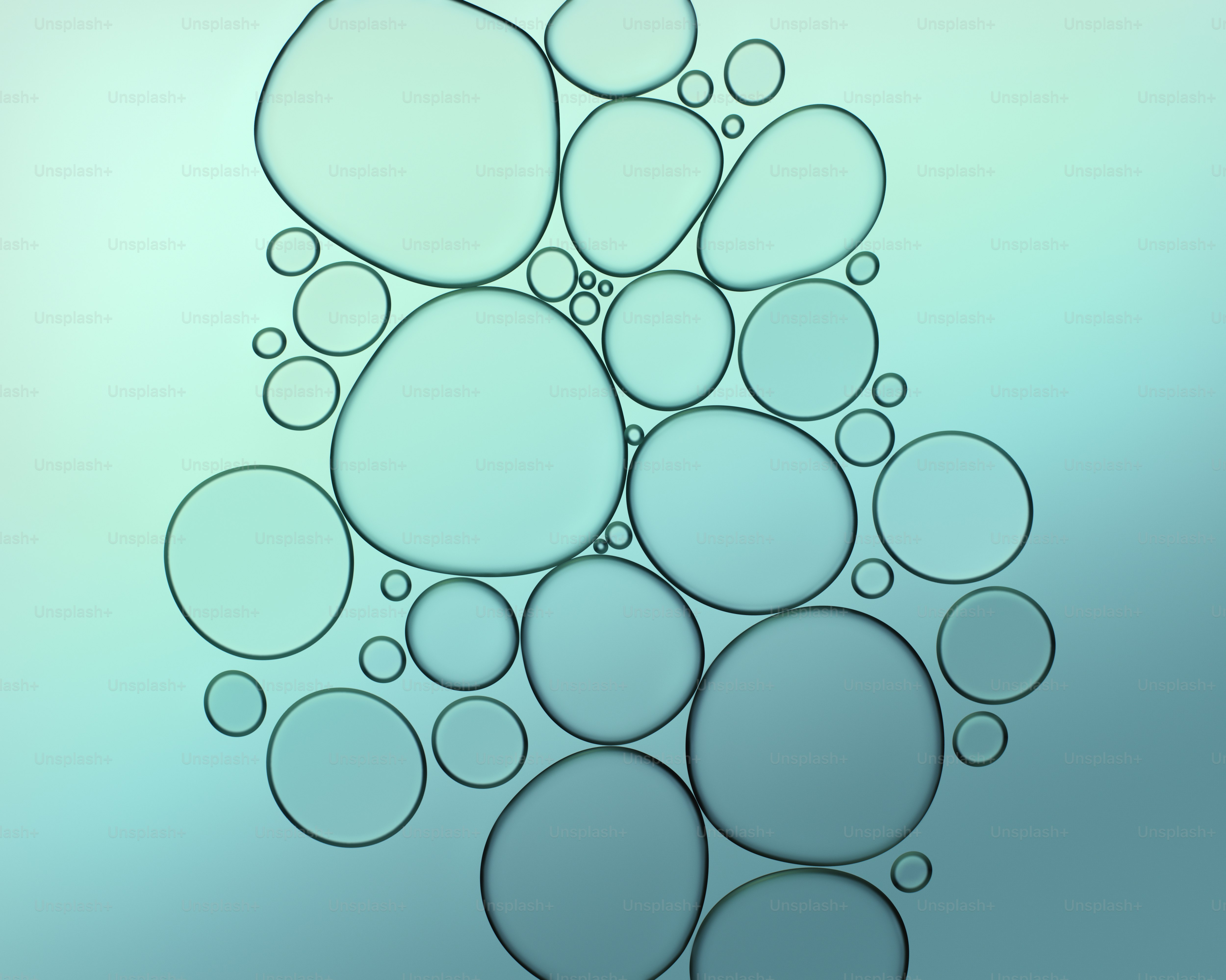 Cluster of irregular and circular bubbles against a blue gradient ...
