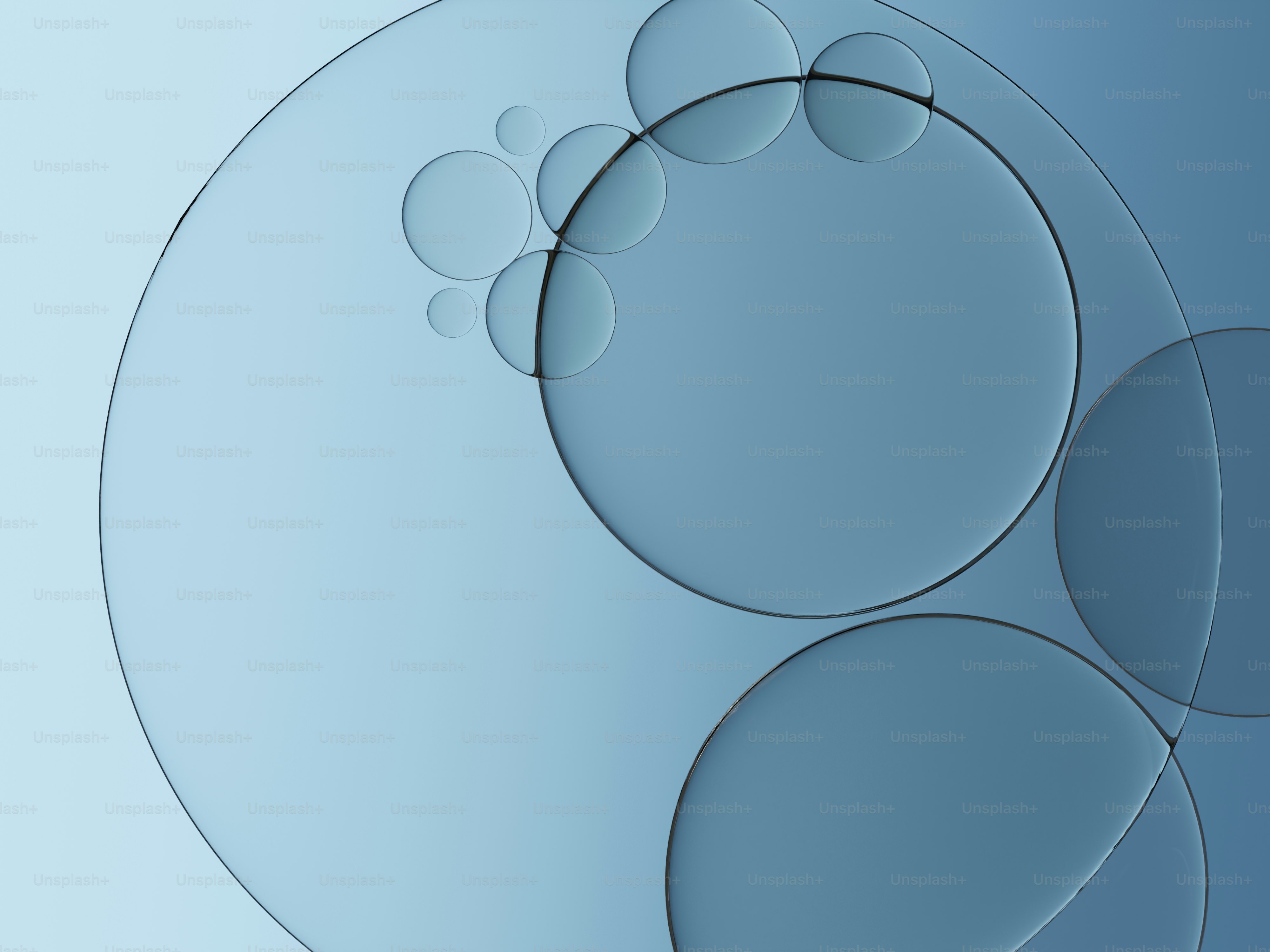 グラデーション背景に抽象的な青い円と泡が描かれています