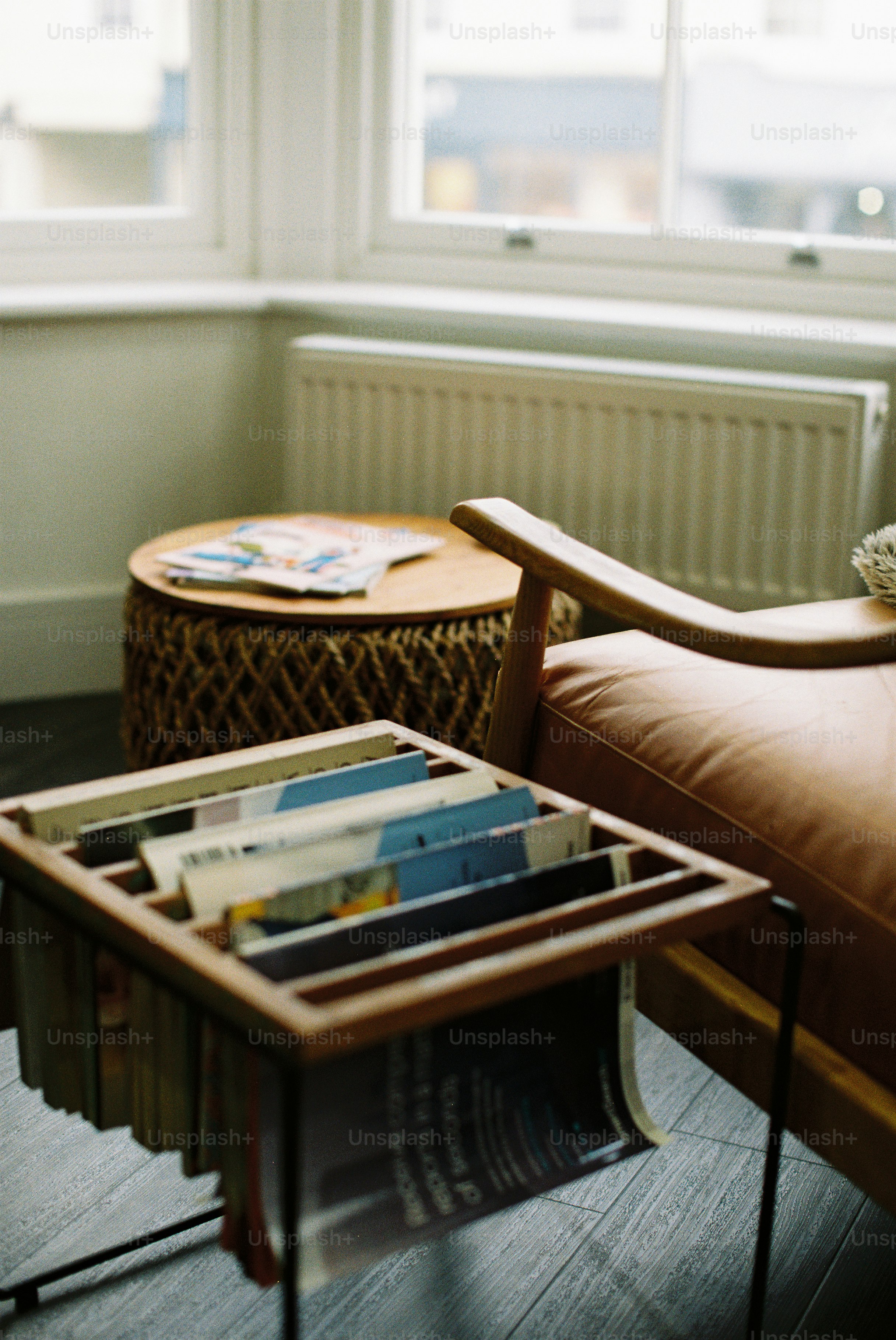 A cozy corner with a leather chair and magazines