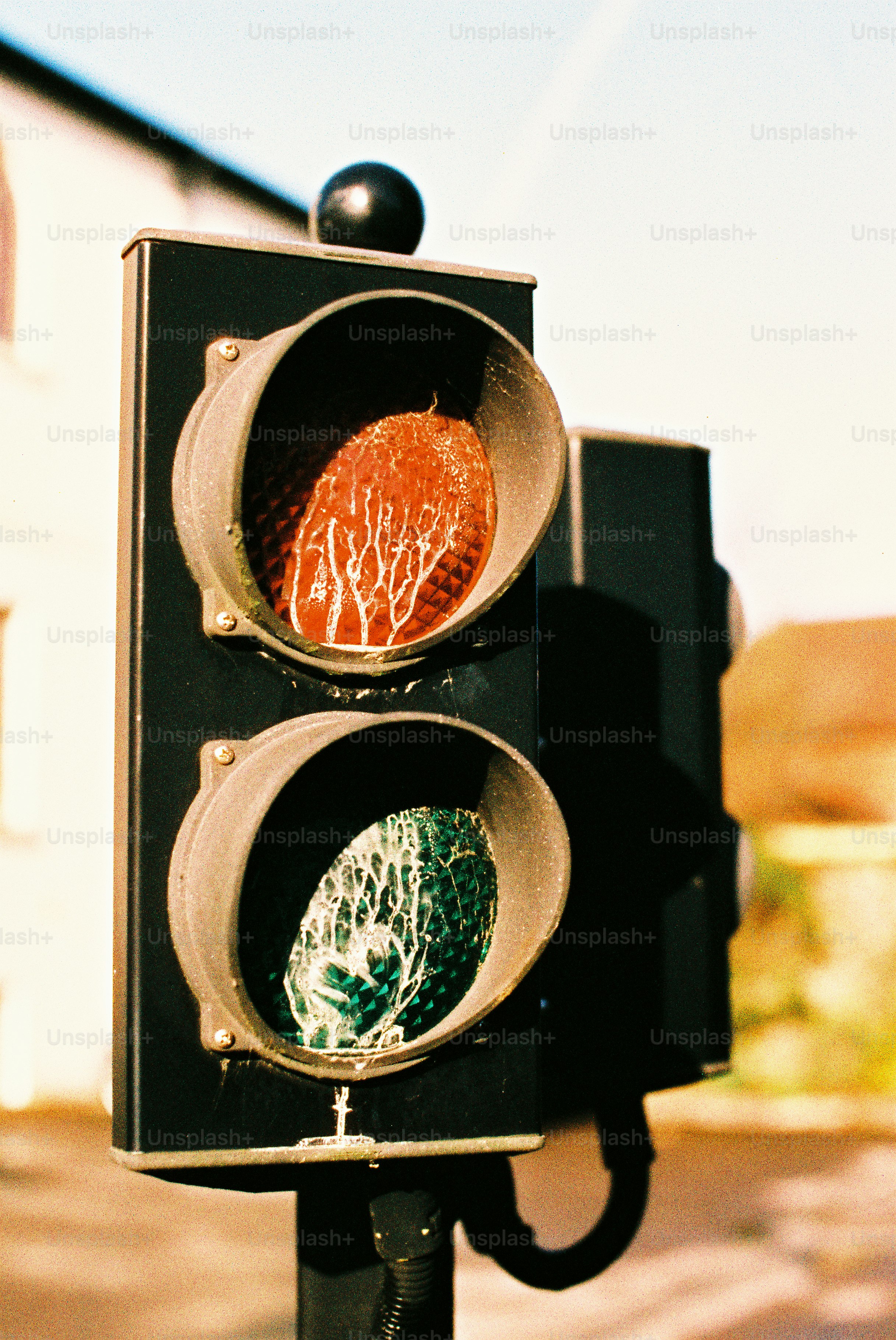 Traffic light showing red and green signals. photo - Film Image on Unsplash