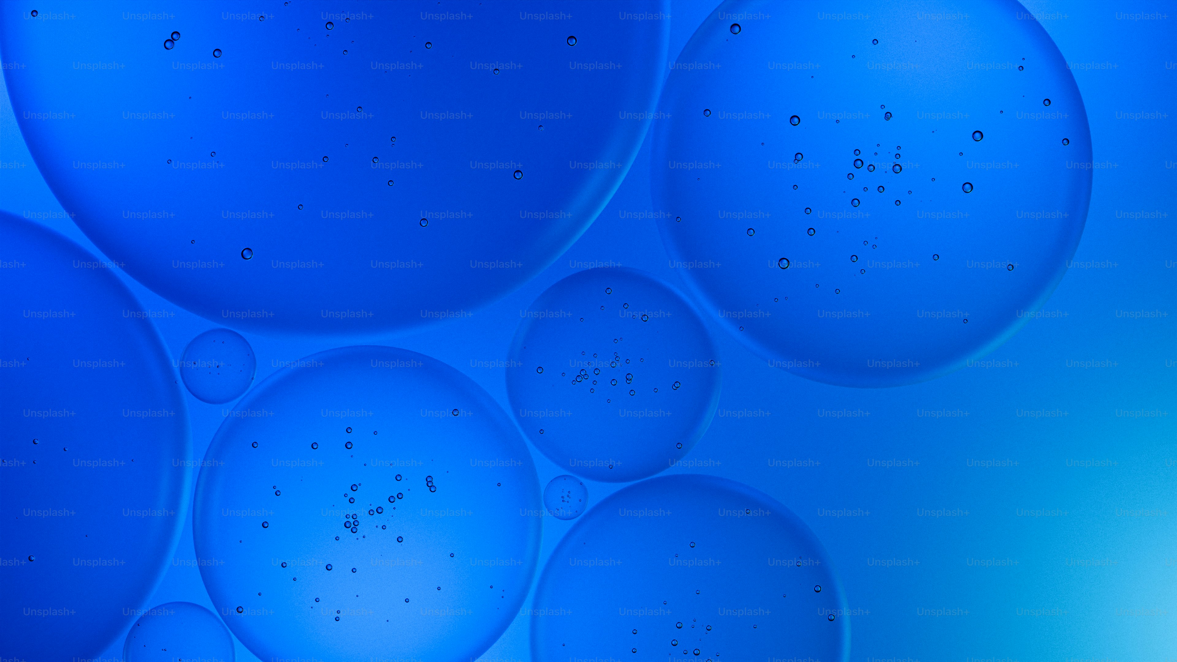 Abstract blue spheres with subtle texture details.