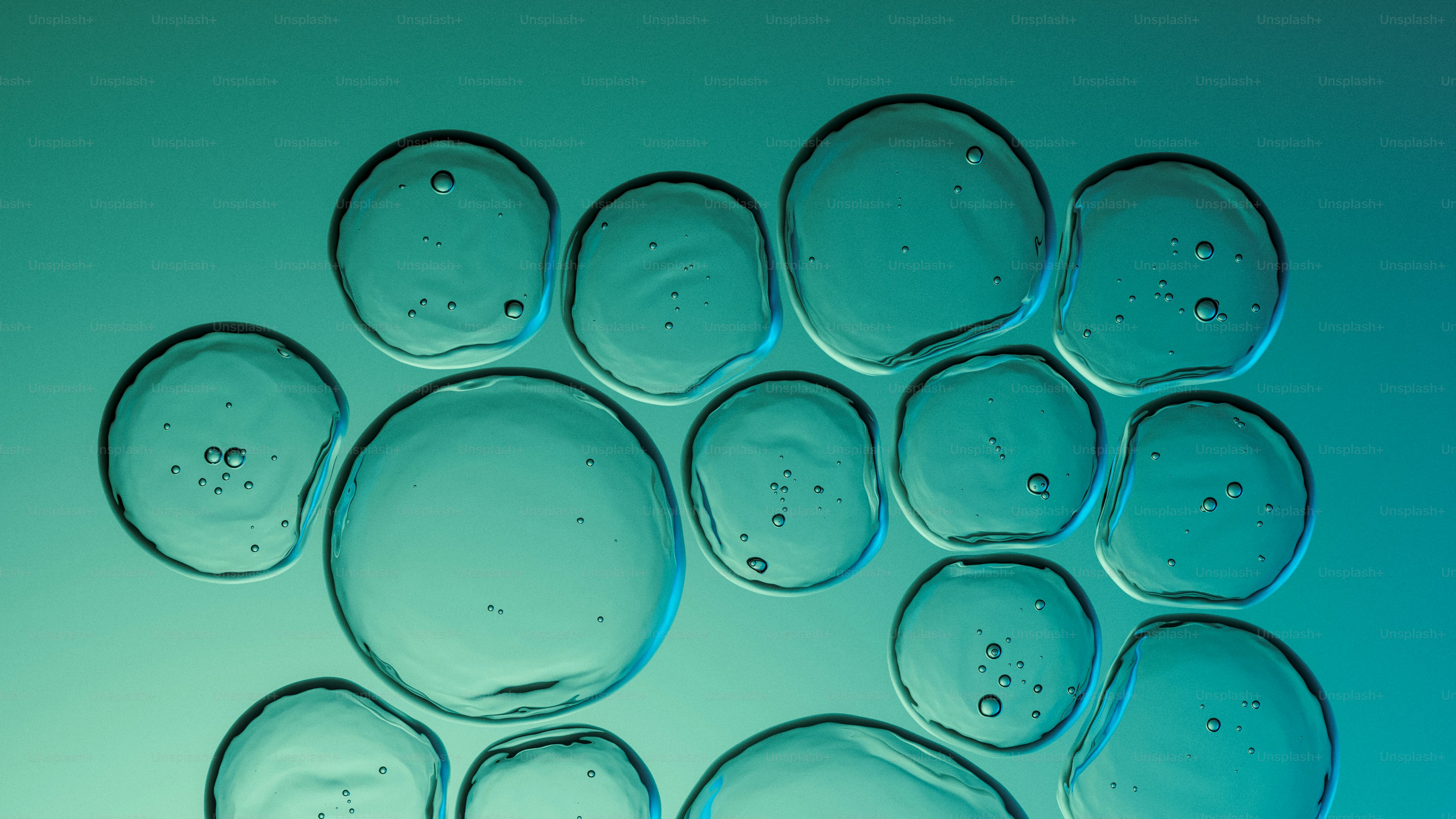 Clear liquid bubbles on a teal background