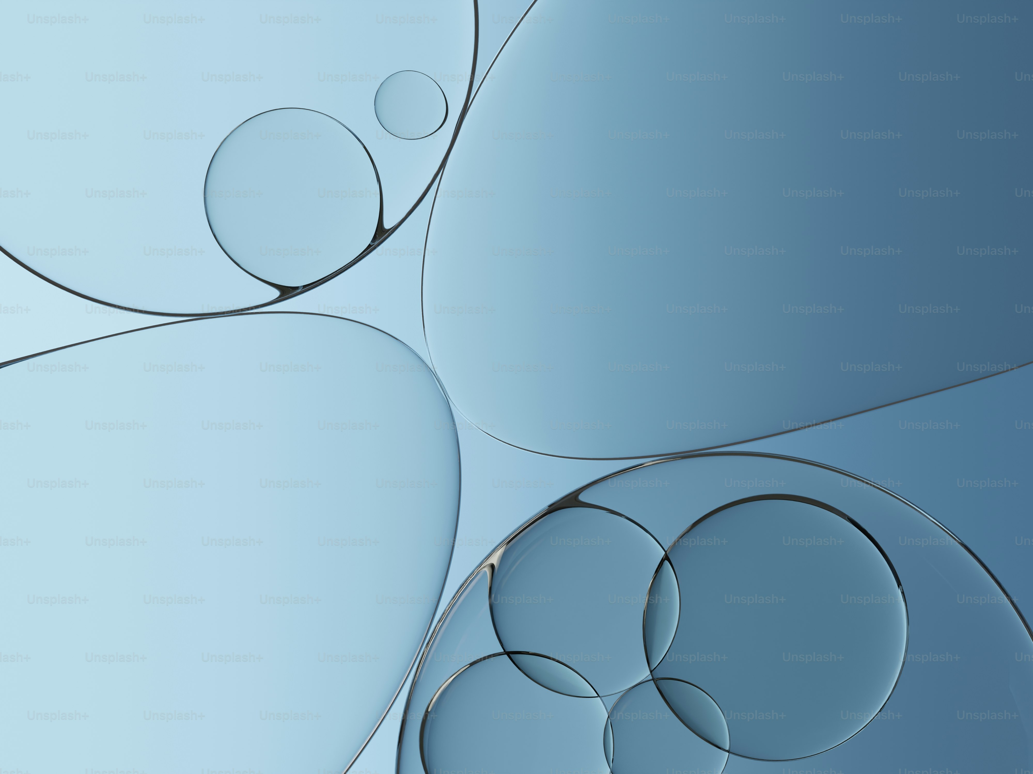 抽象的な青い背景に半透明の円と曲線が描かれています