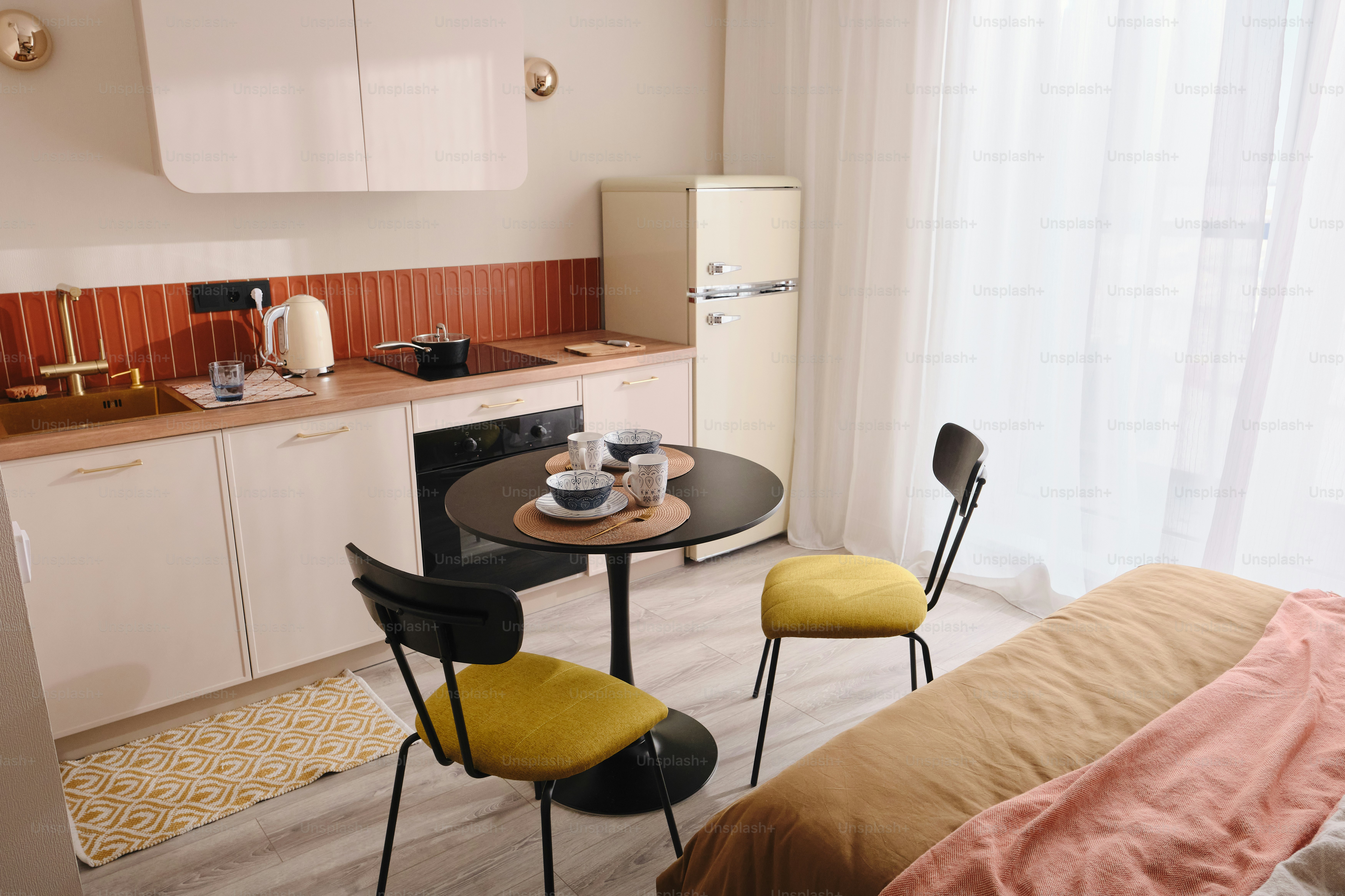 Compact studio apartment with kitchen and dining area