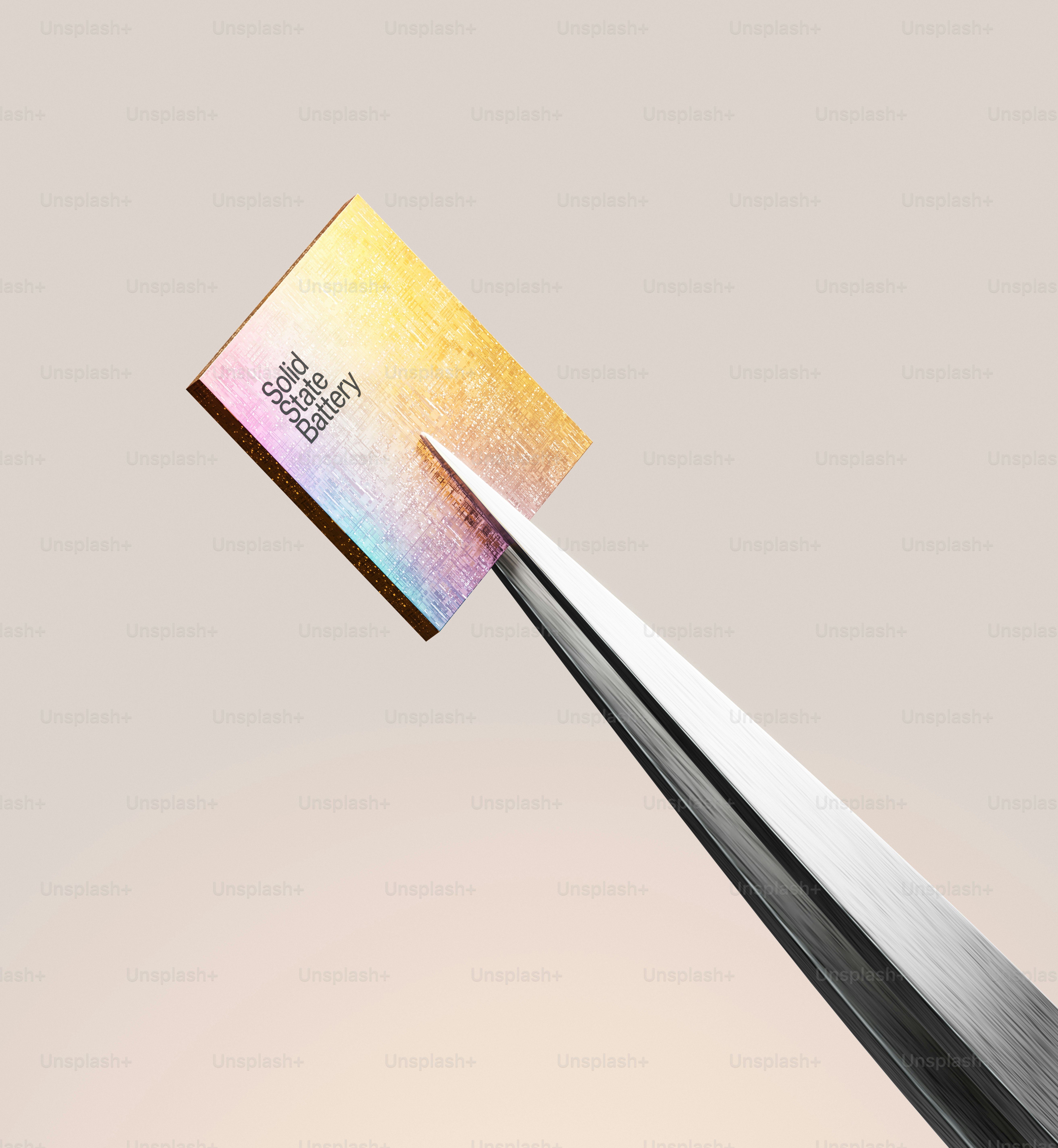 Tweezers holding a small golden circuit board.