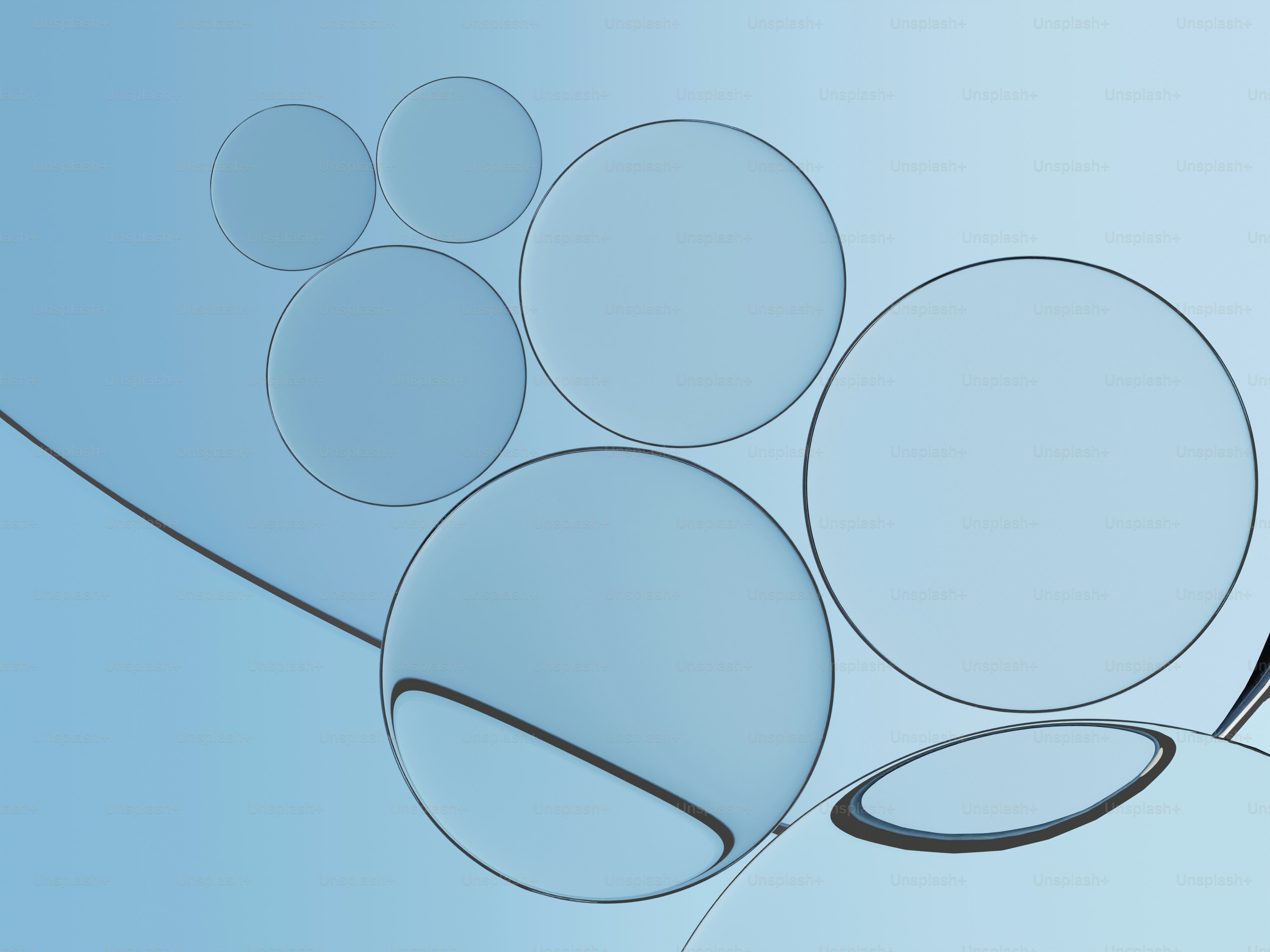 グラデーションの背景にいくつかの透明な青い球体が描かれている。