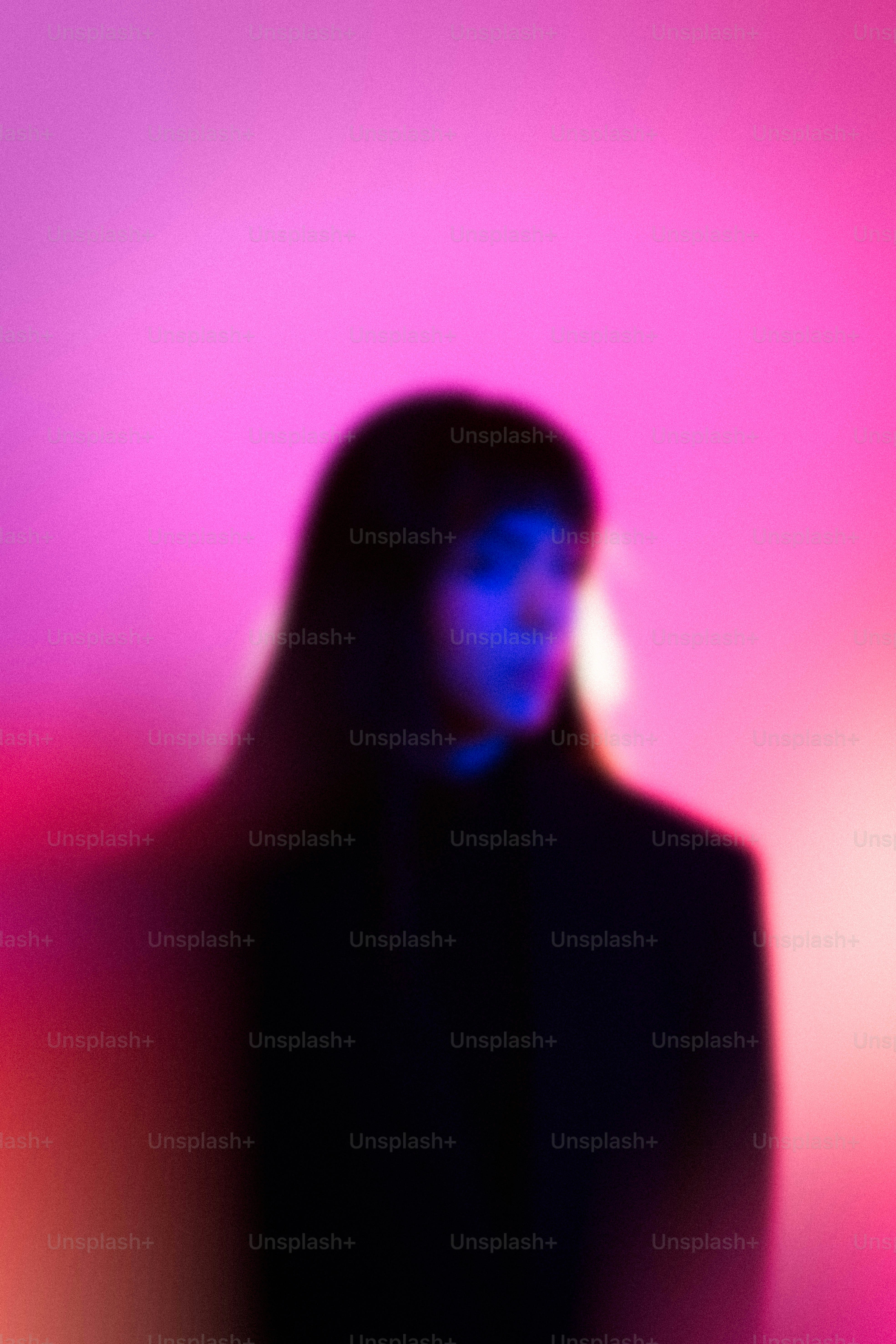 A blurred portrait with pink and blue lighting photo – Portrait Image ...