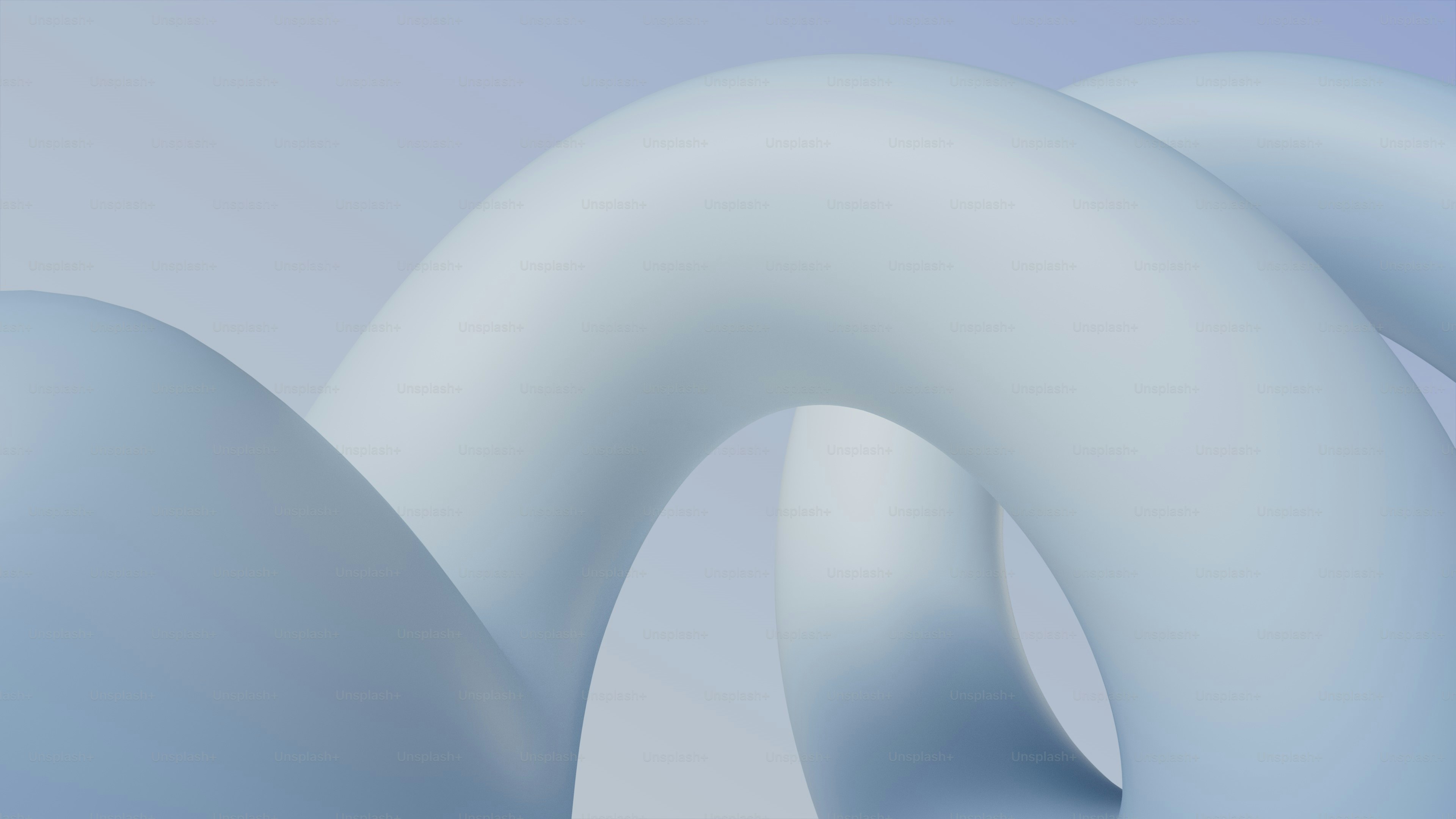 Abstrakte pastellblaue Torusformen im sanften Licht