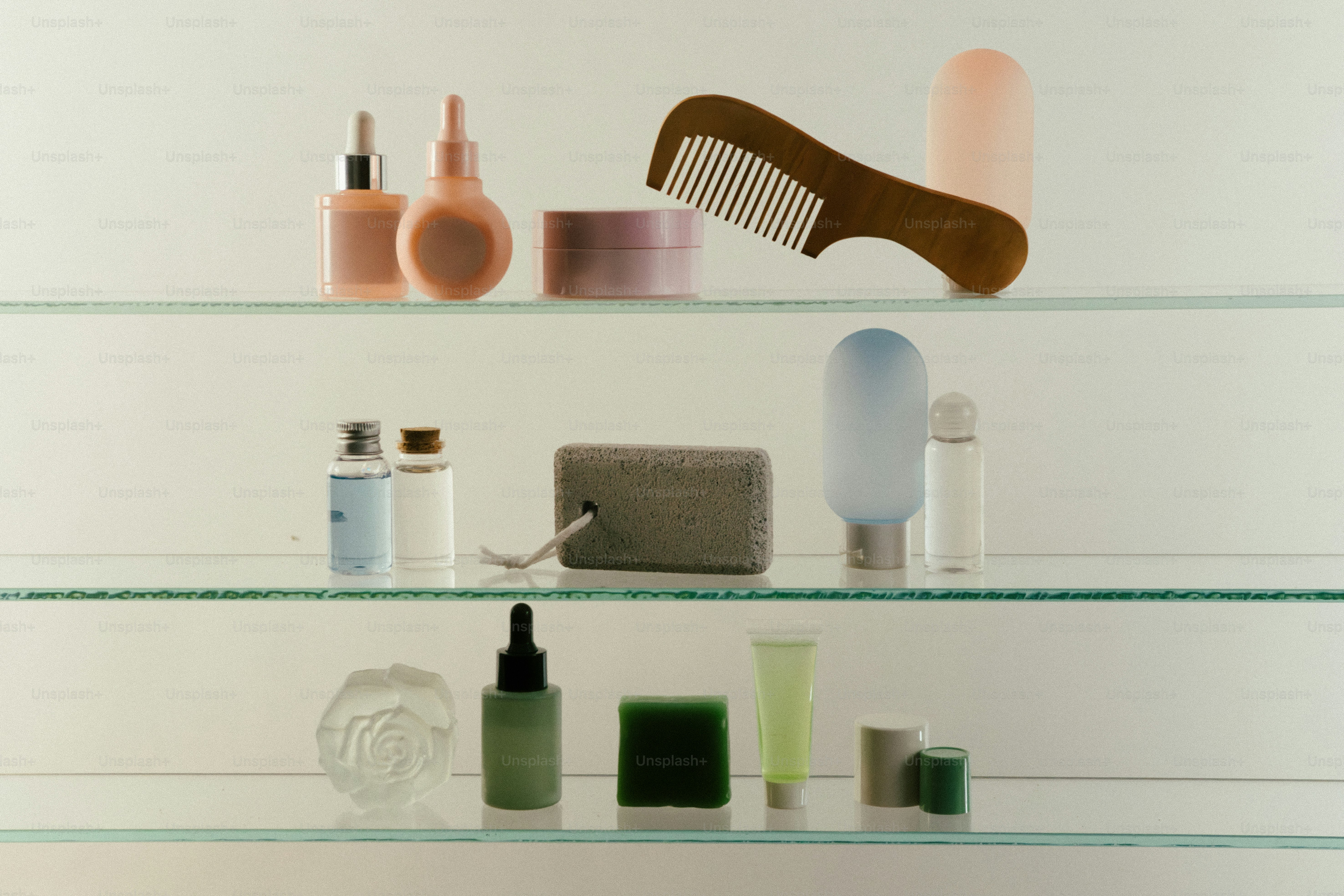 Various skincare products and a wooden comb on shelves.