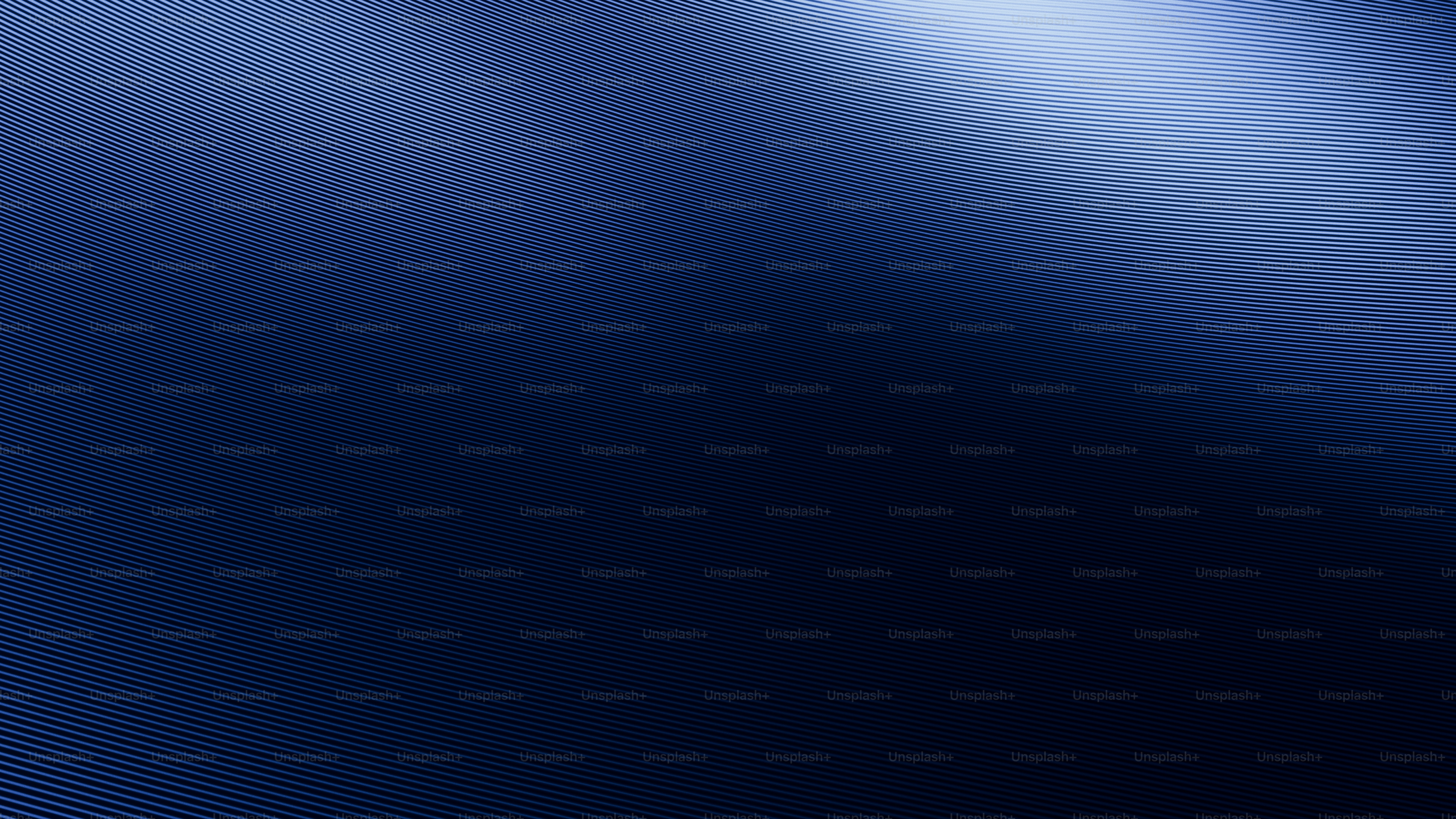 Deep blue gradient with subtle texture and light reflection