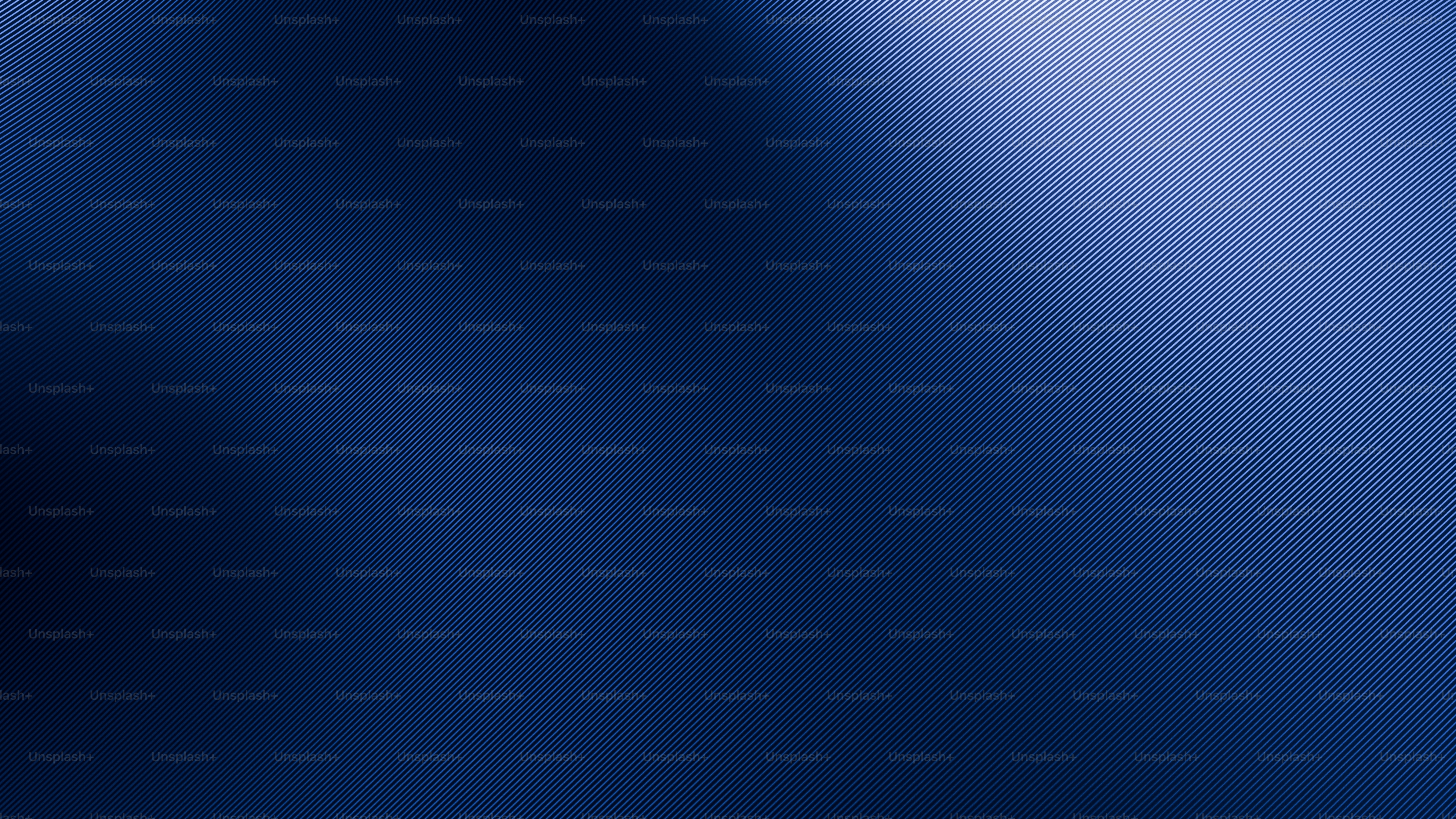 Deep blue abstract background with soft light streaks