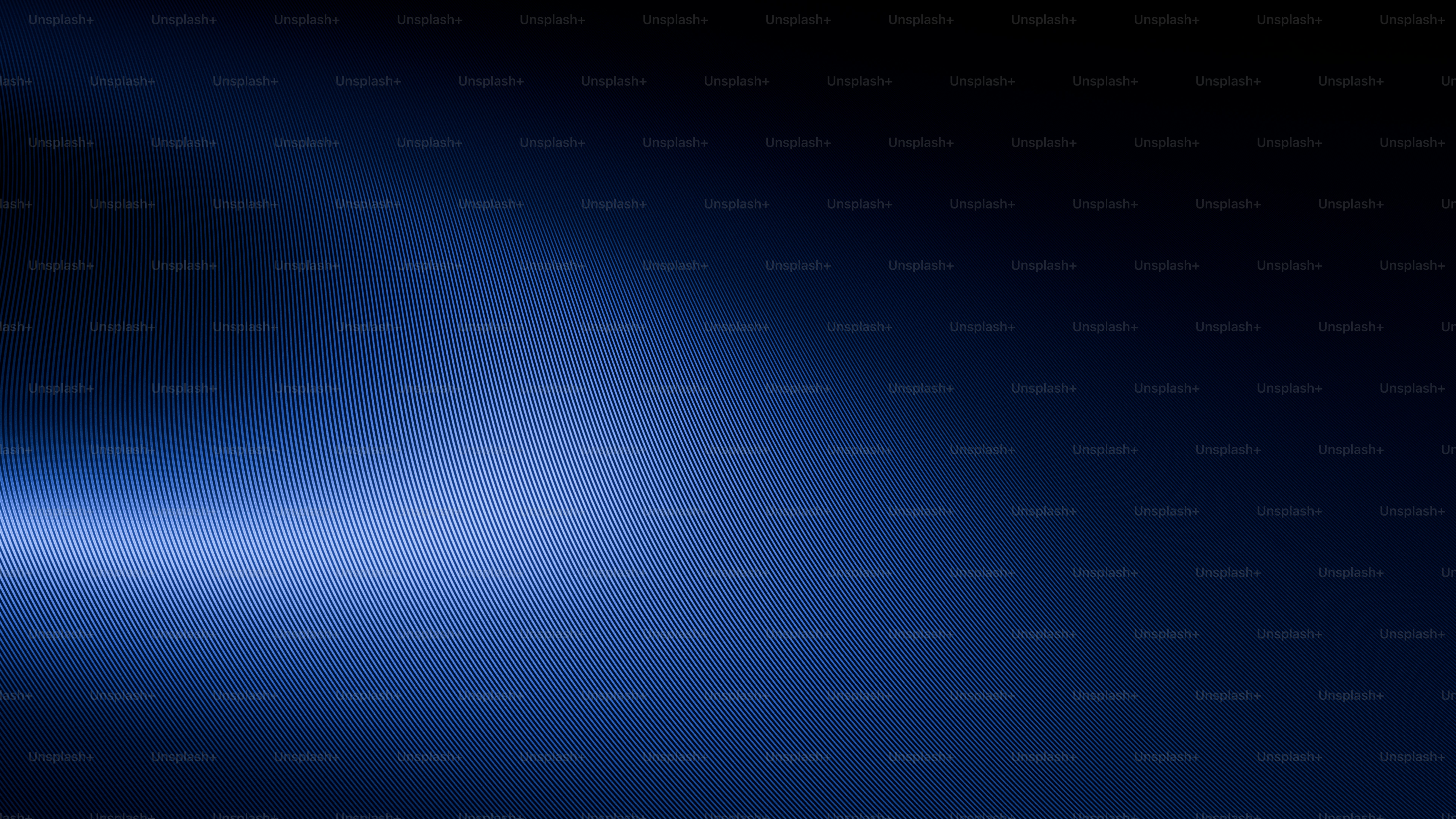 Abstract blue light swirl on dark background
