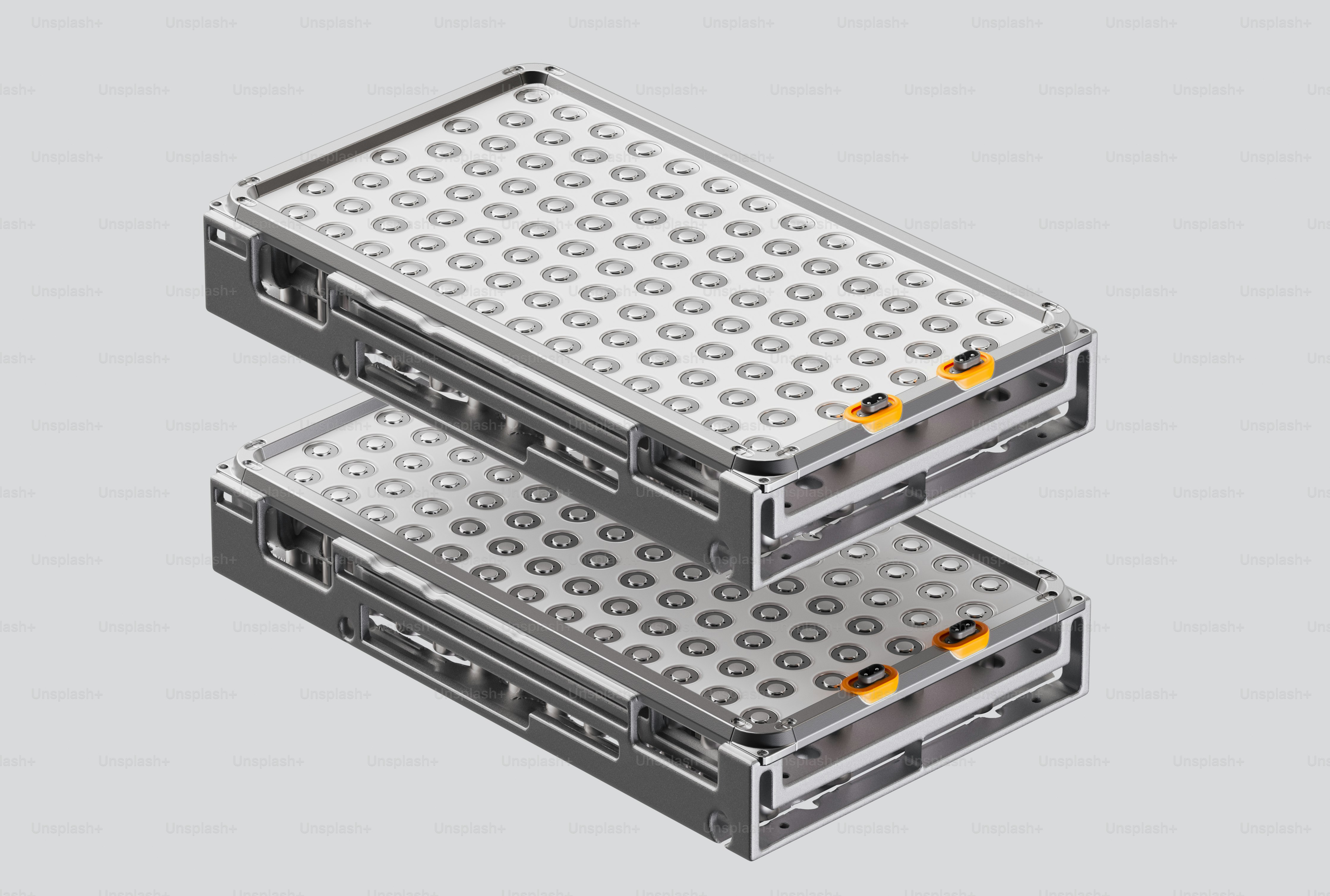 Two stacked laboratory microplates on a grey background
