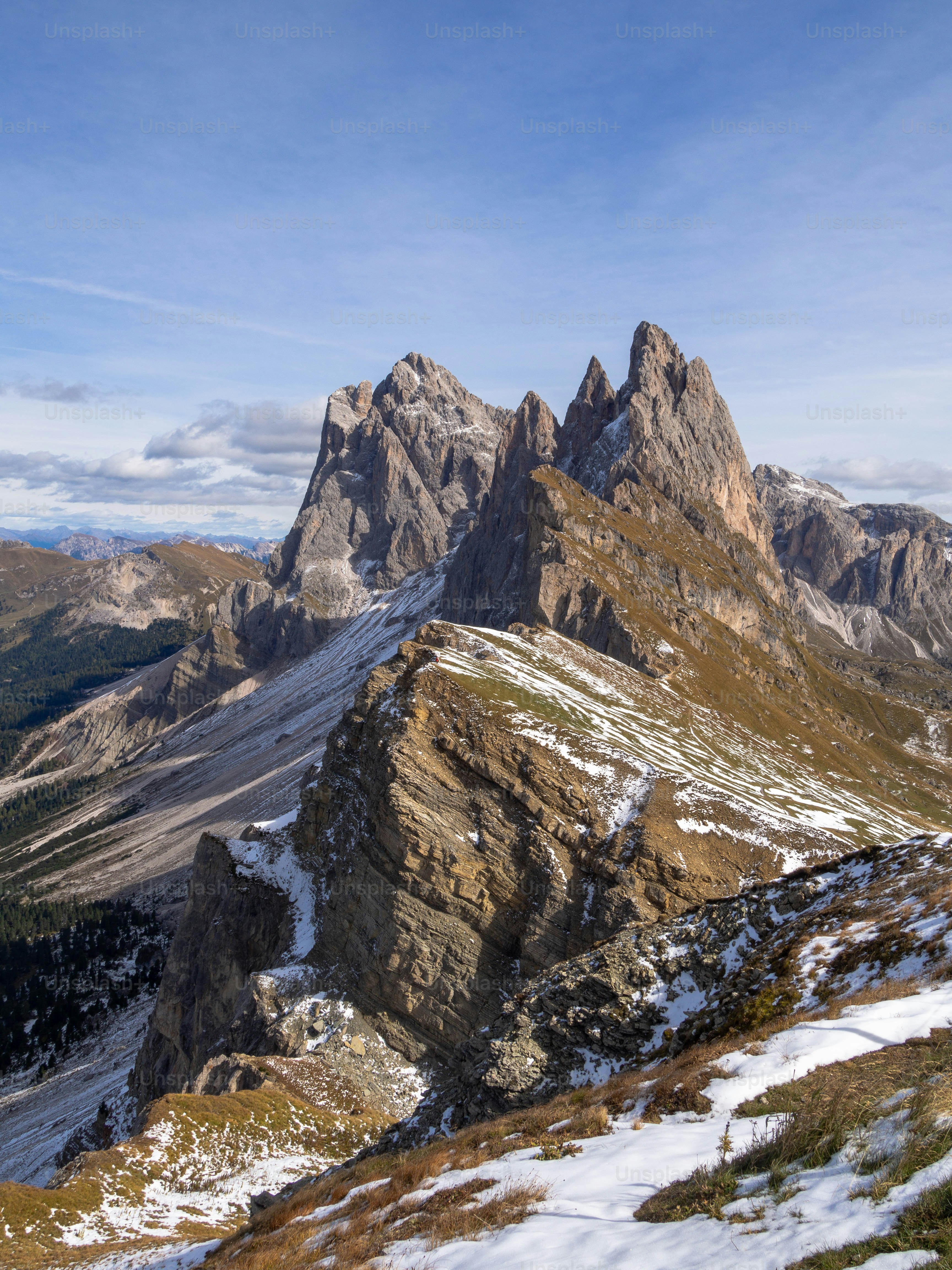 Jagged mountain peaks under a clear blue sky photo – Travel Image on ...