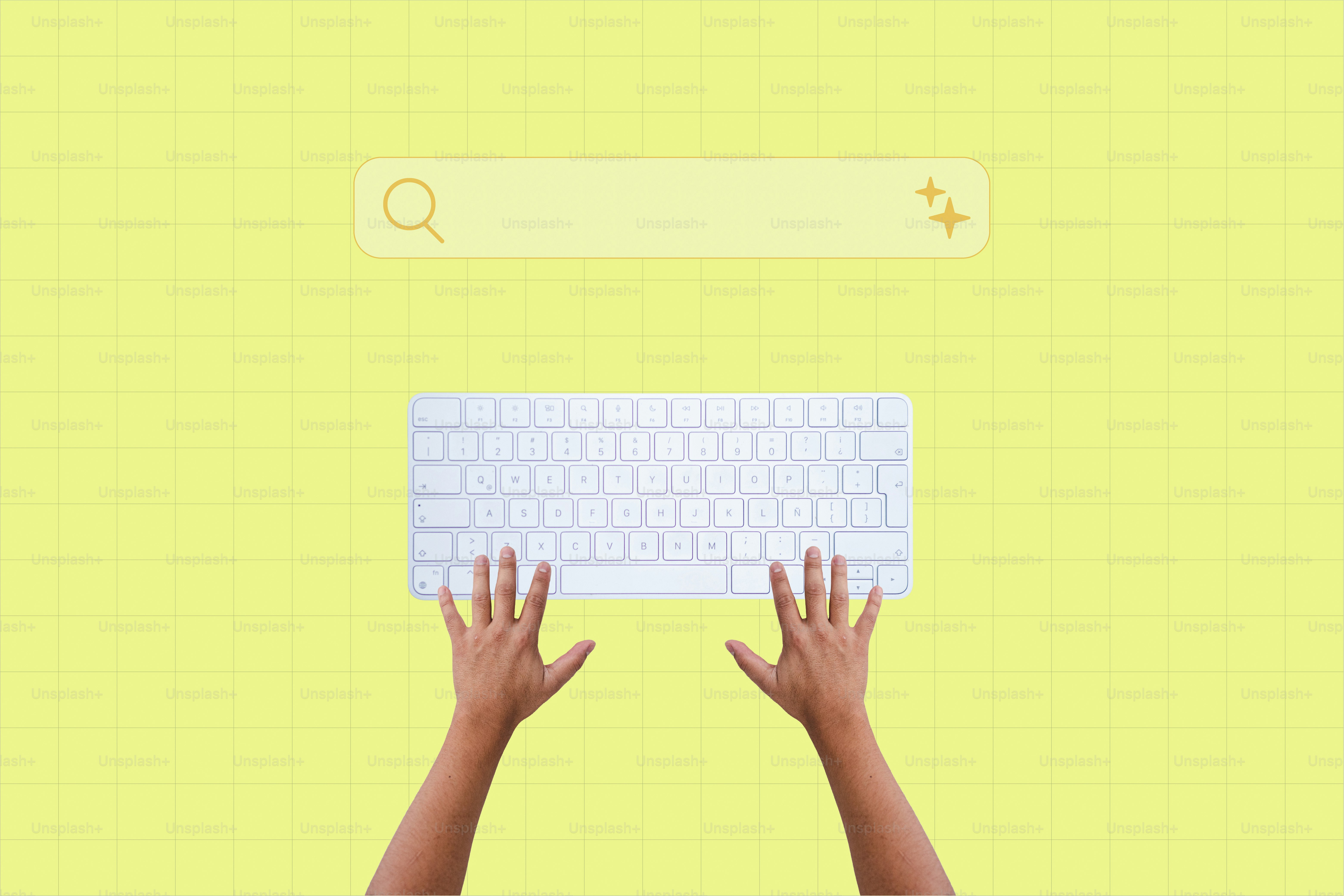 Hands typing on a keyboard below a search bar.