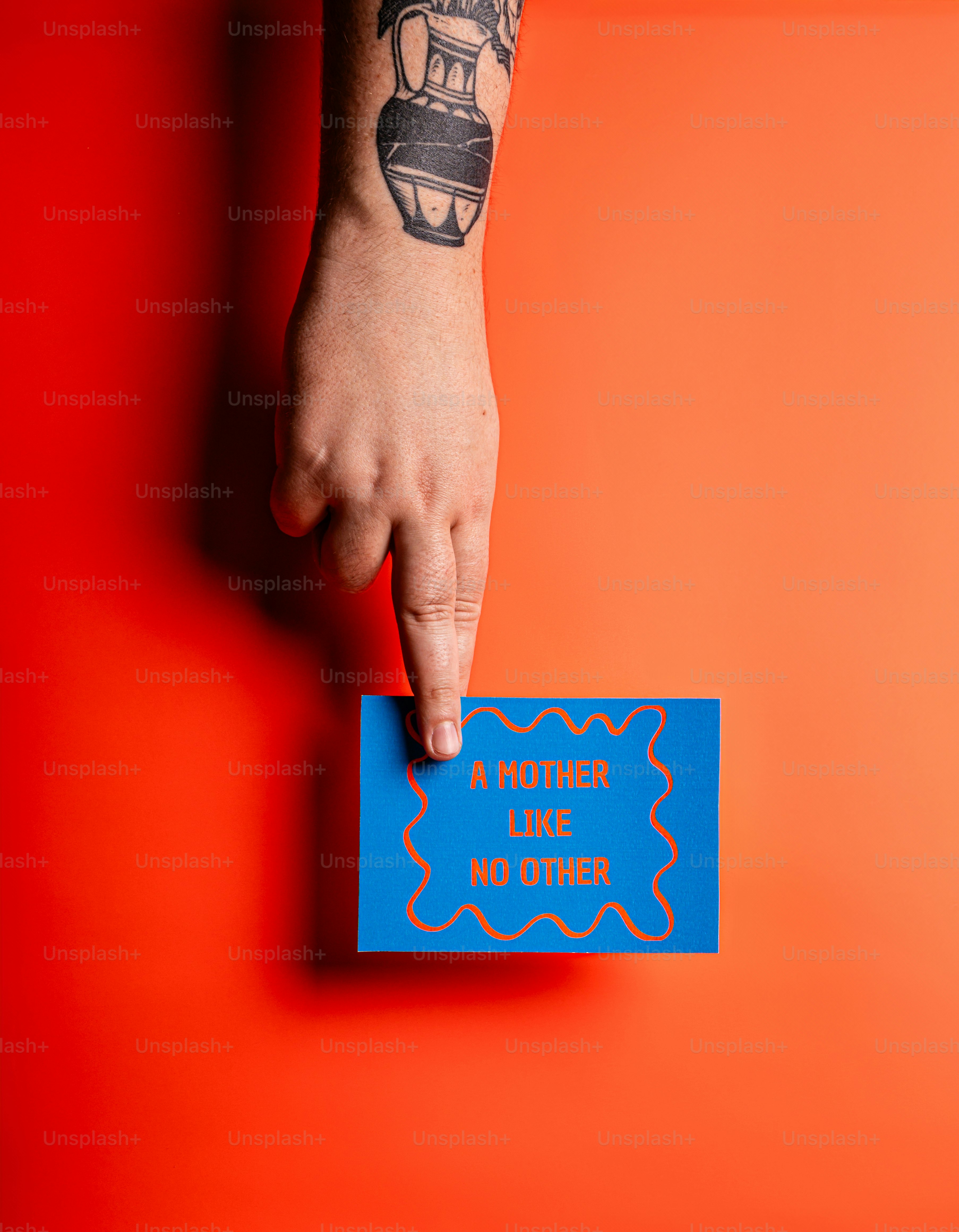 A hand points to a blue card with text.