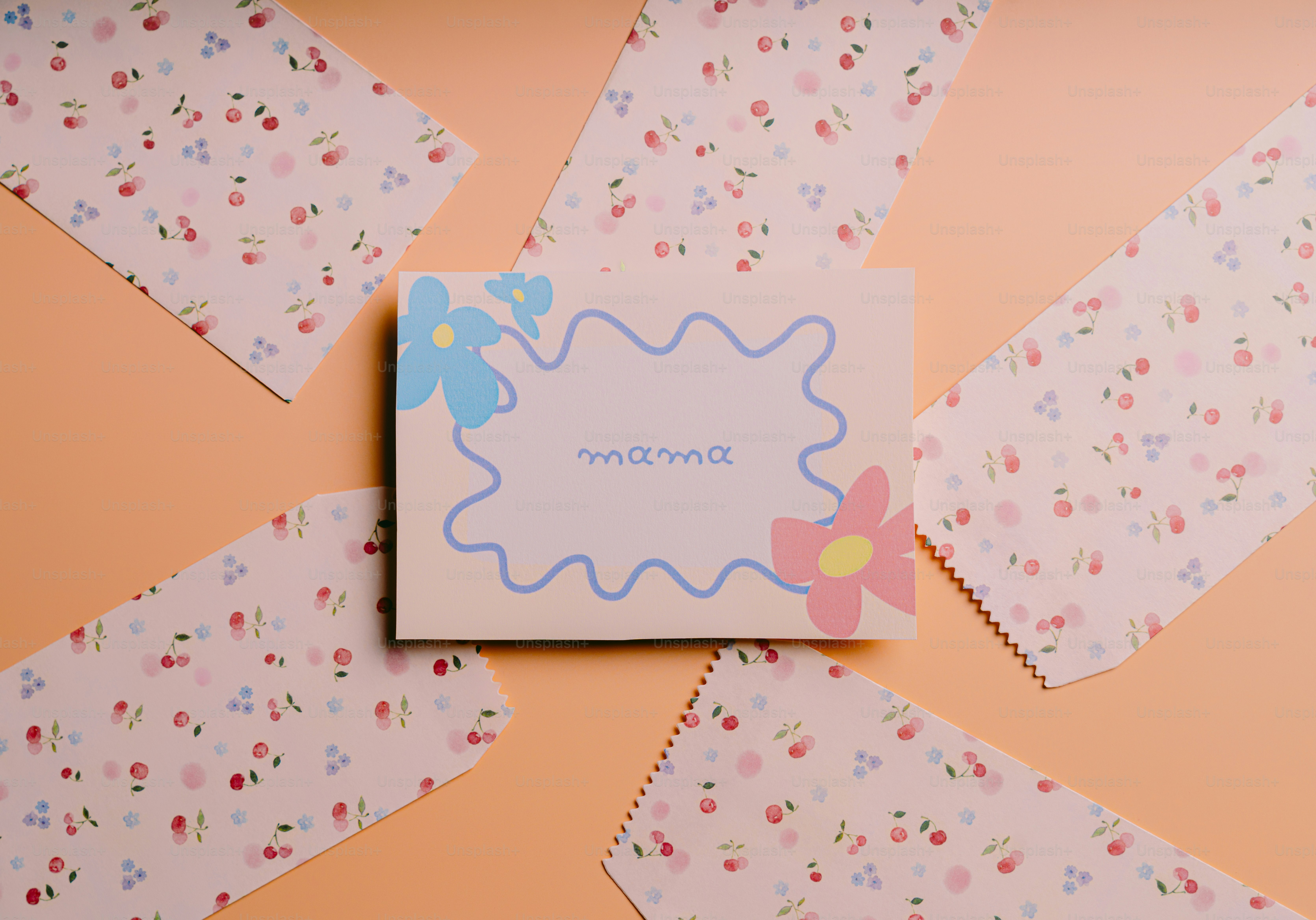 A flat lay of floral patterned papers around a card.