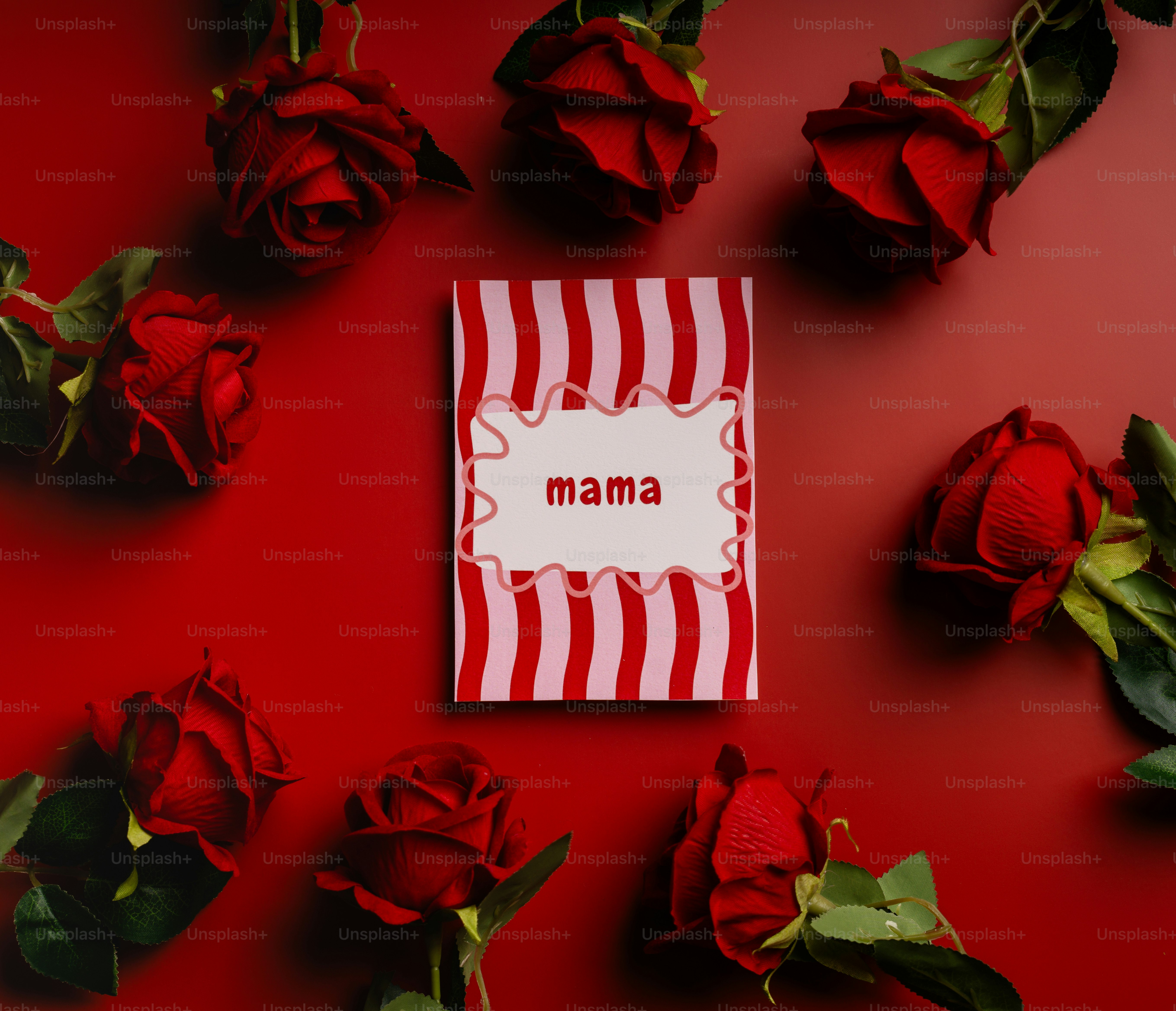 Red roses surround a card that says "mama"