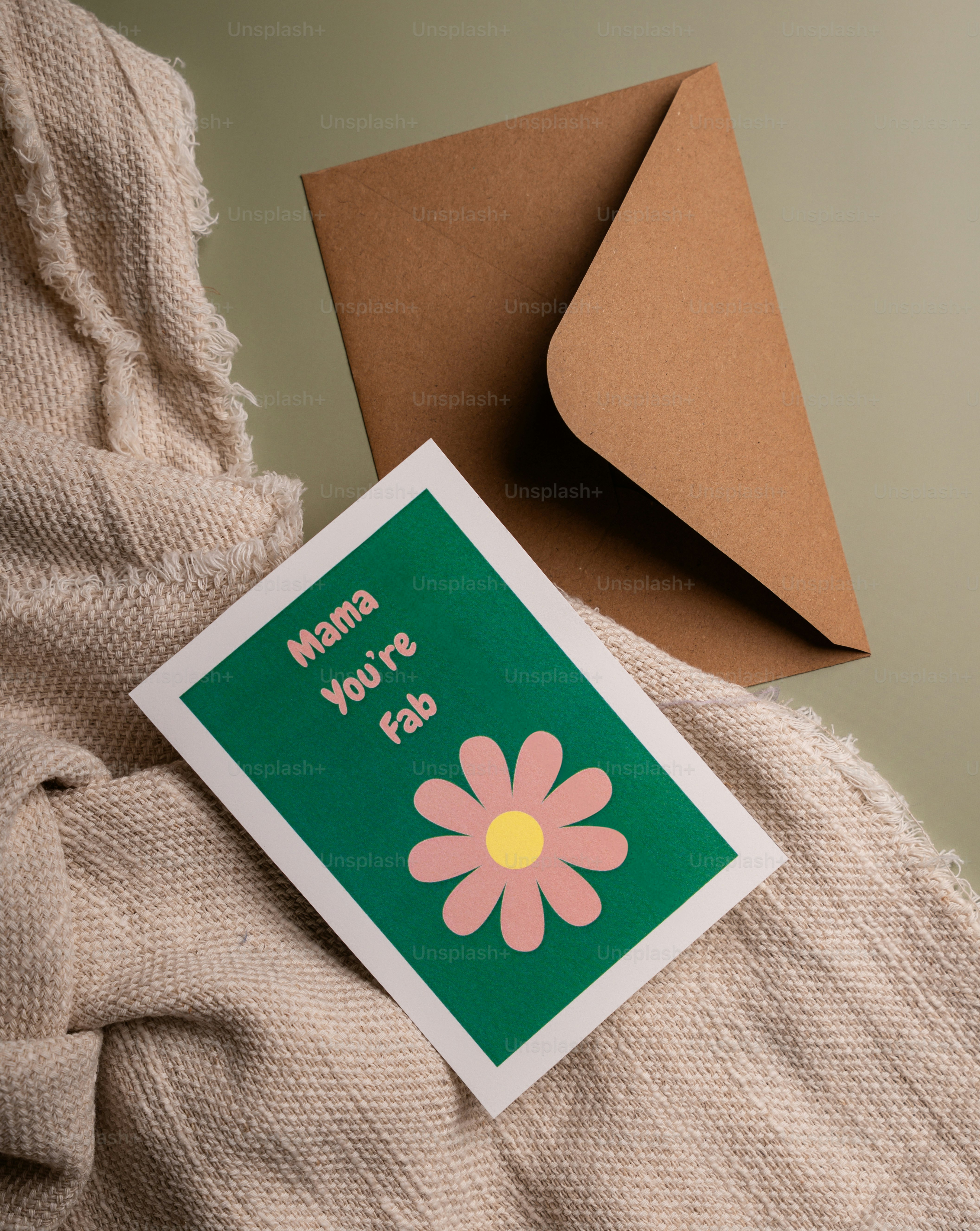 Card with "mama you're fab" and a flower
