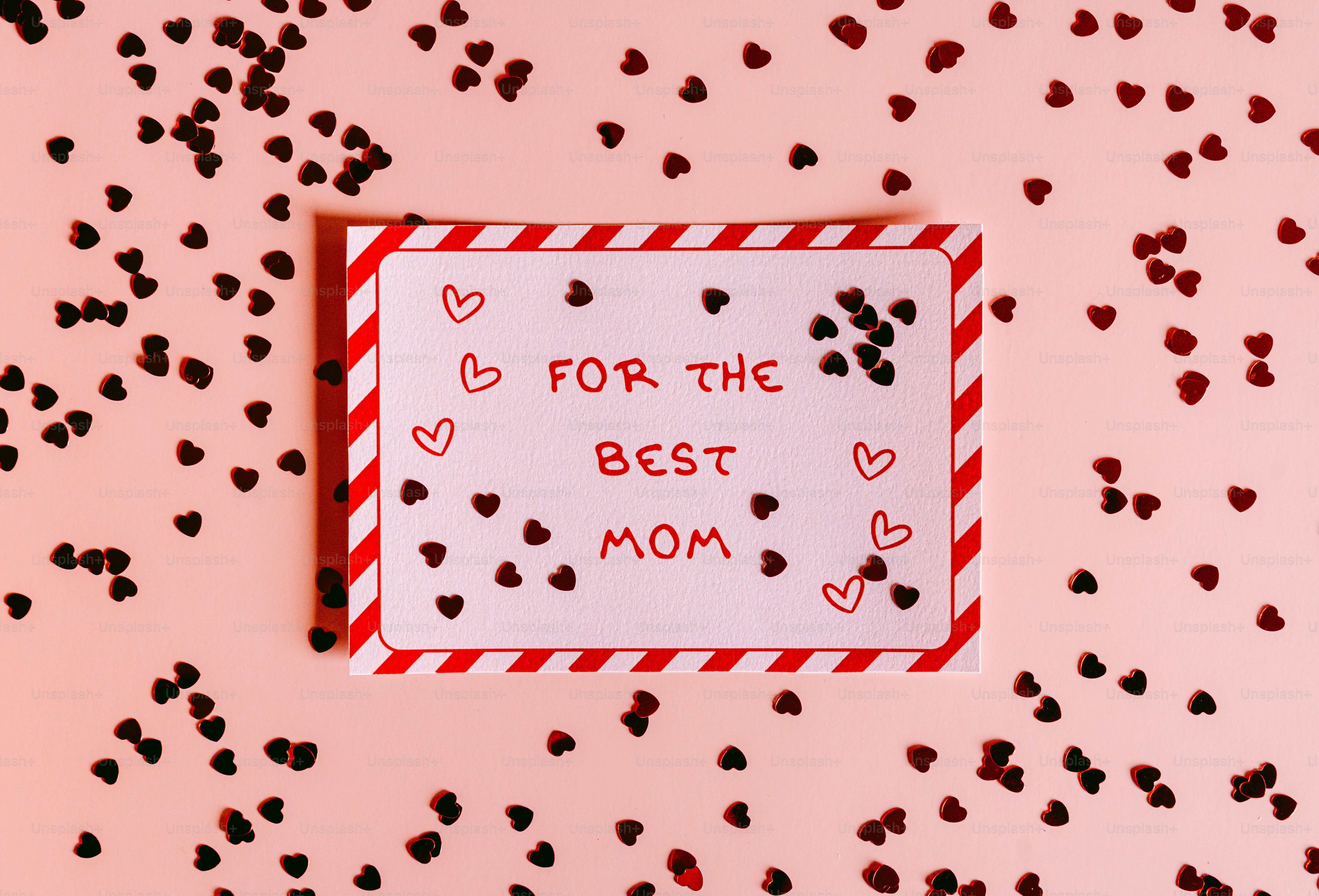 Card with "for the best mom" surrounded by hearts.