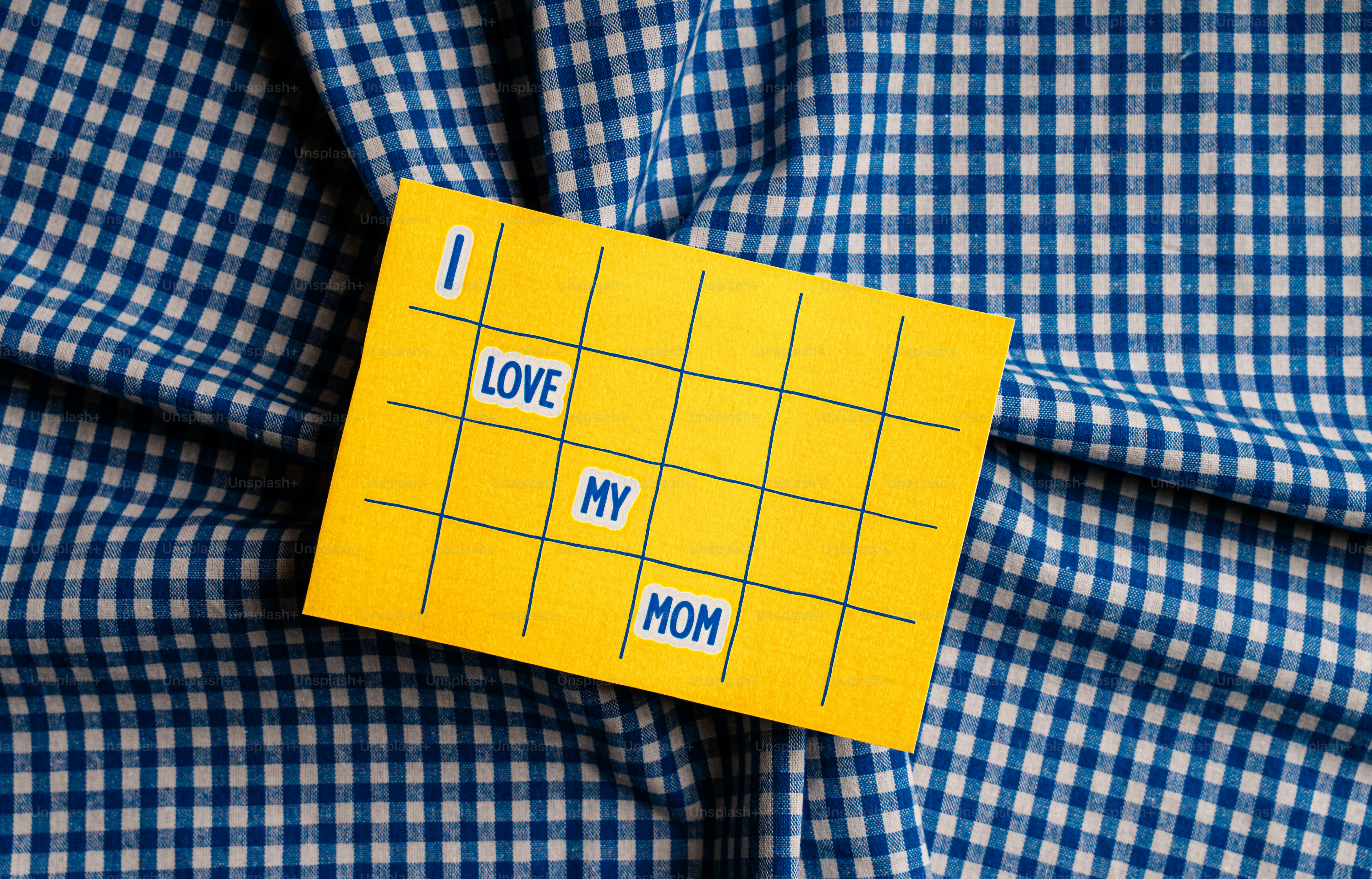 Yellow card with "i love my mom" written on it.