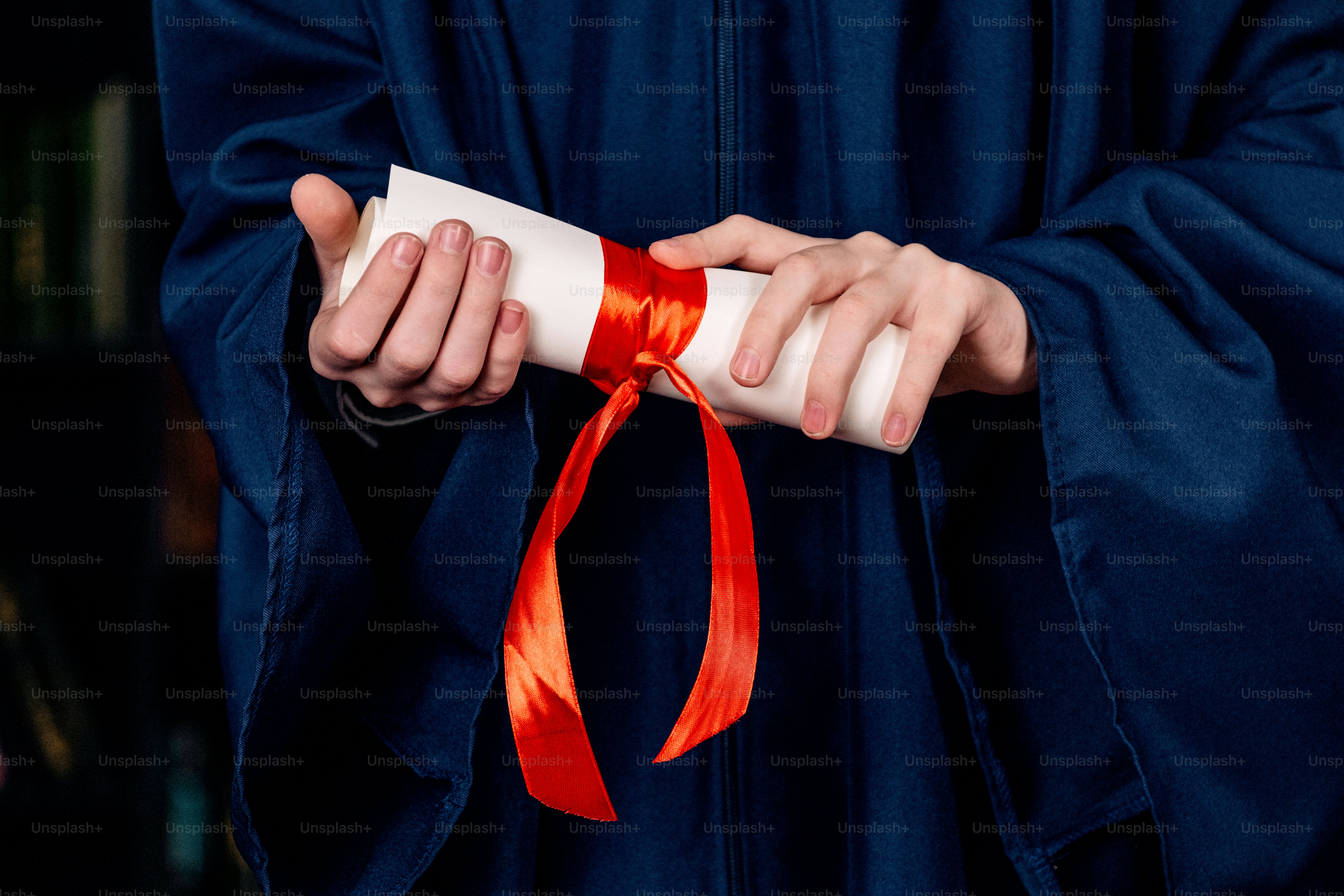 Graduation gown with diploma tied with red ribbon photo – Education ...
