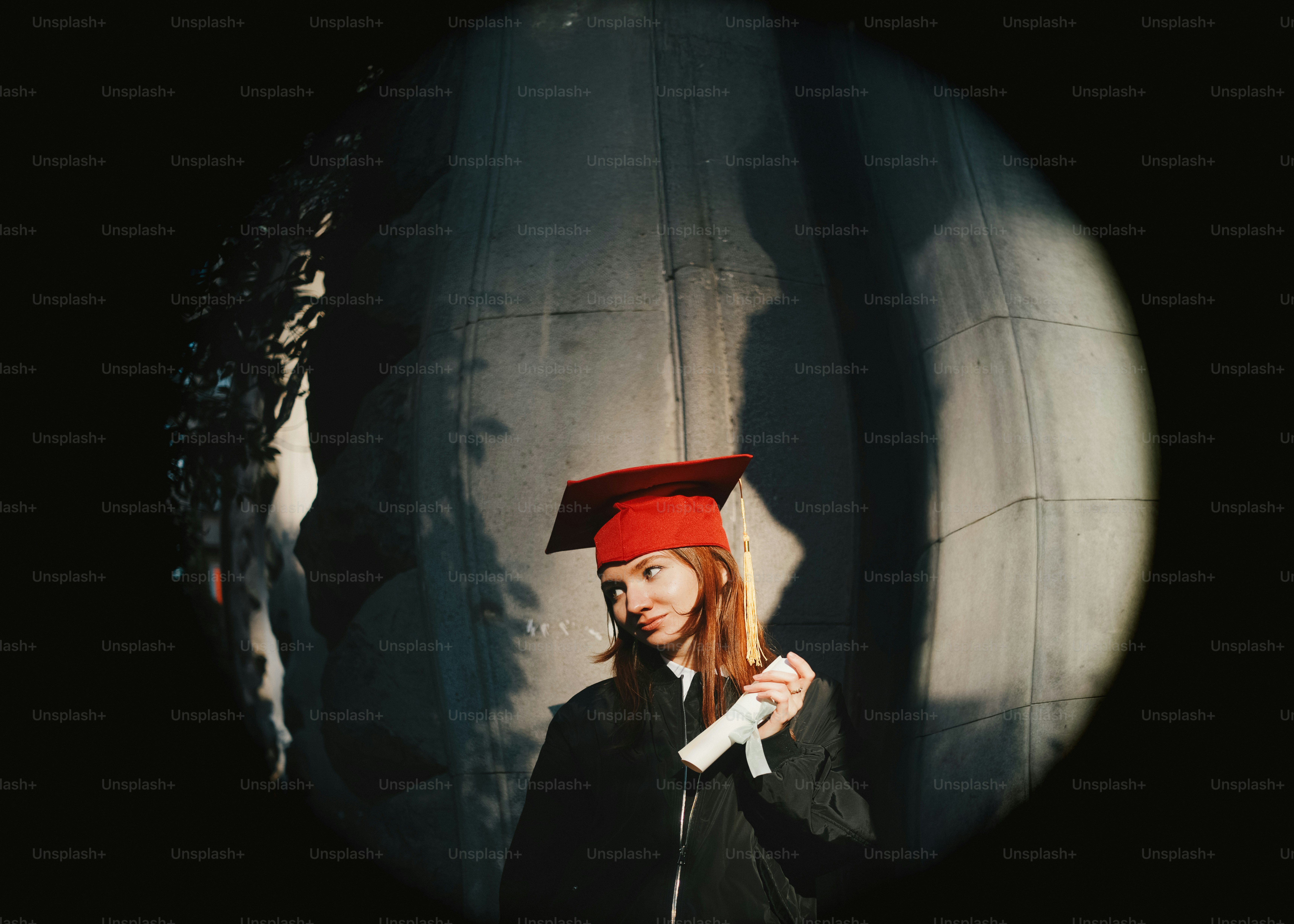 Graduate in cap and gown taking a picture with camera photo – Education ...