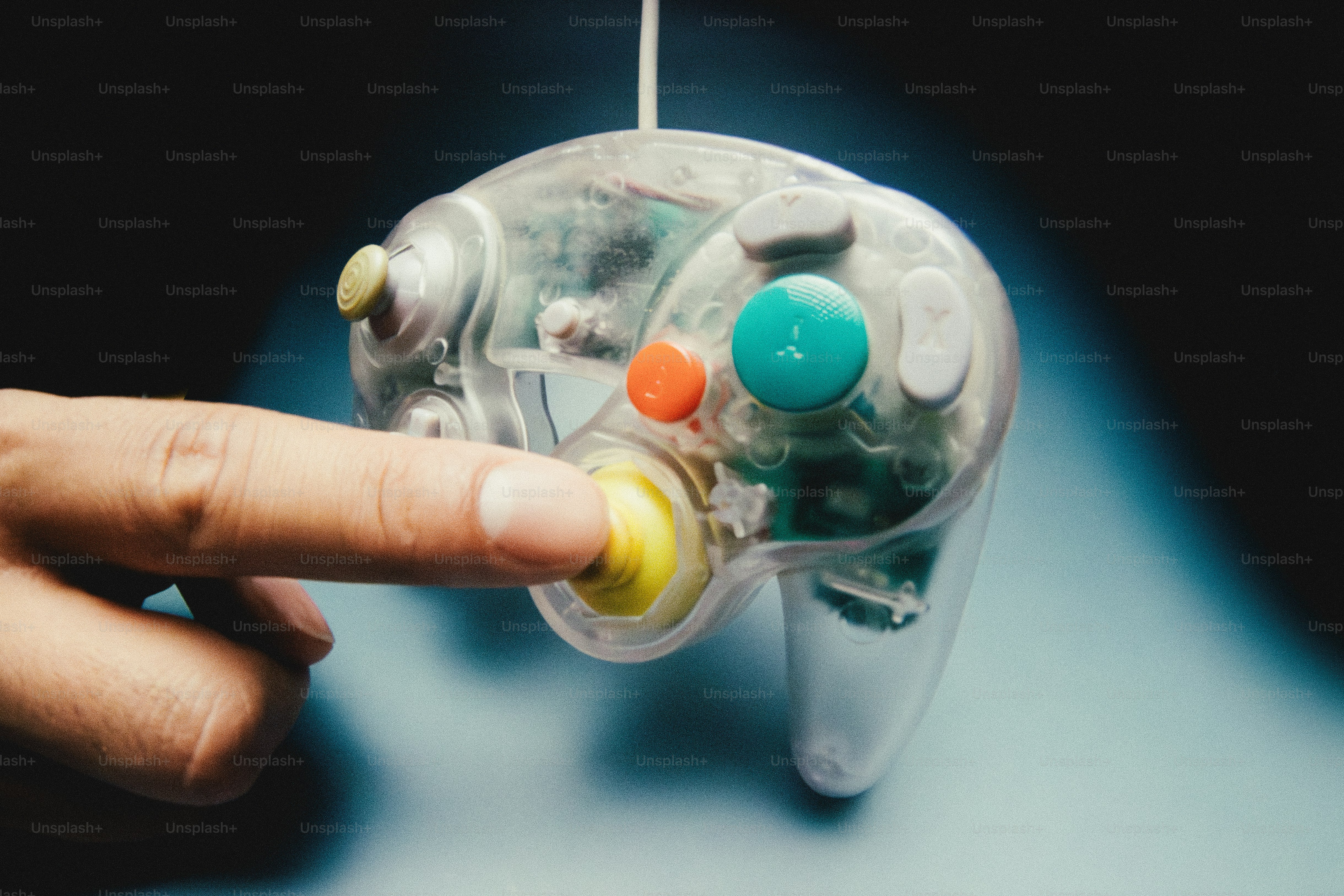Clear video game controllers and discs on a surface photo – Technology ...