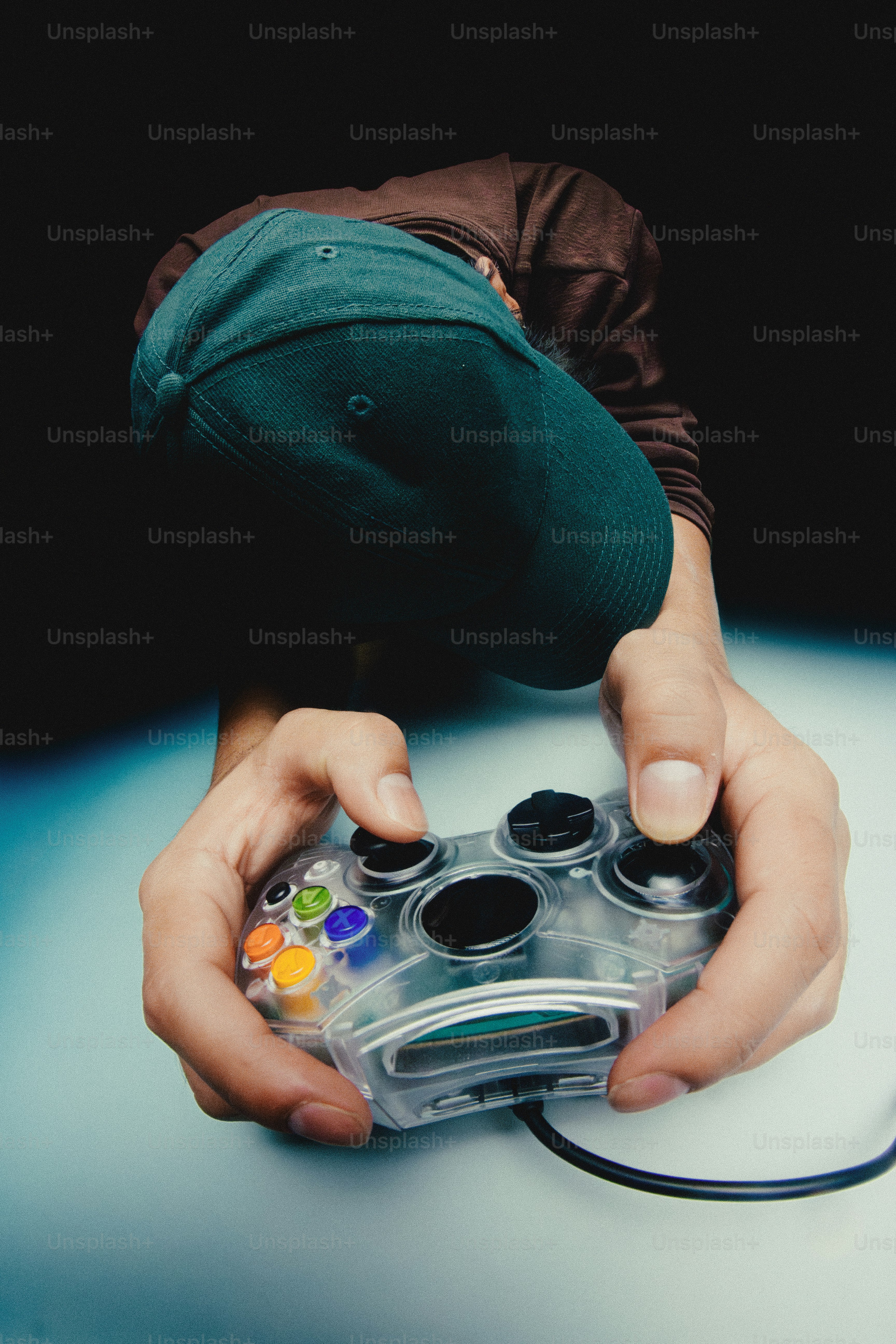 Hand holding a clear video game controller photo – Gaming Image on Unsplash