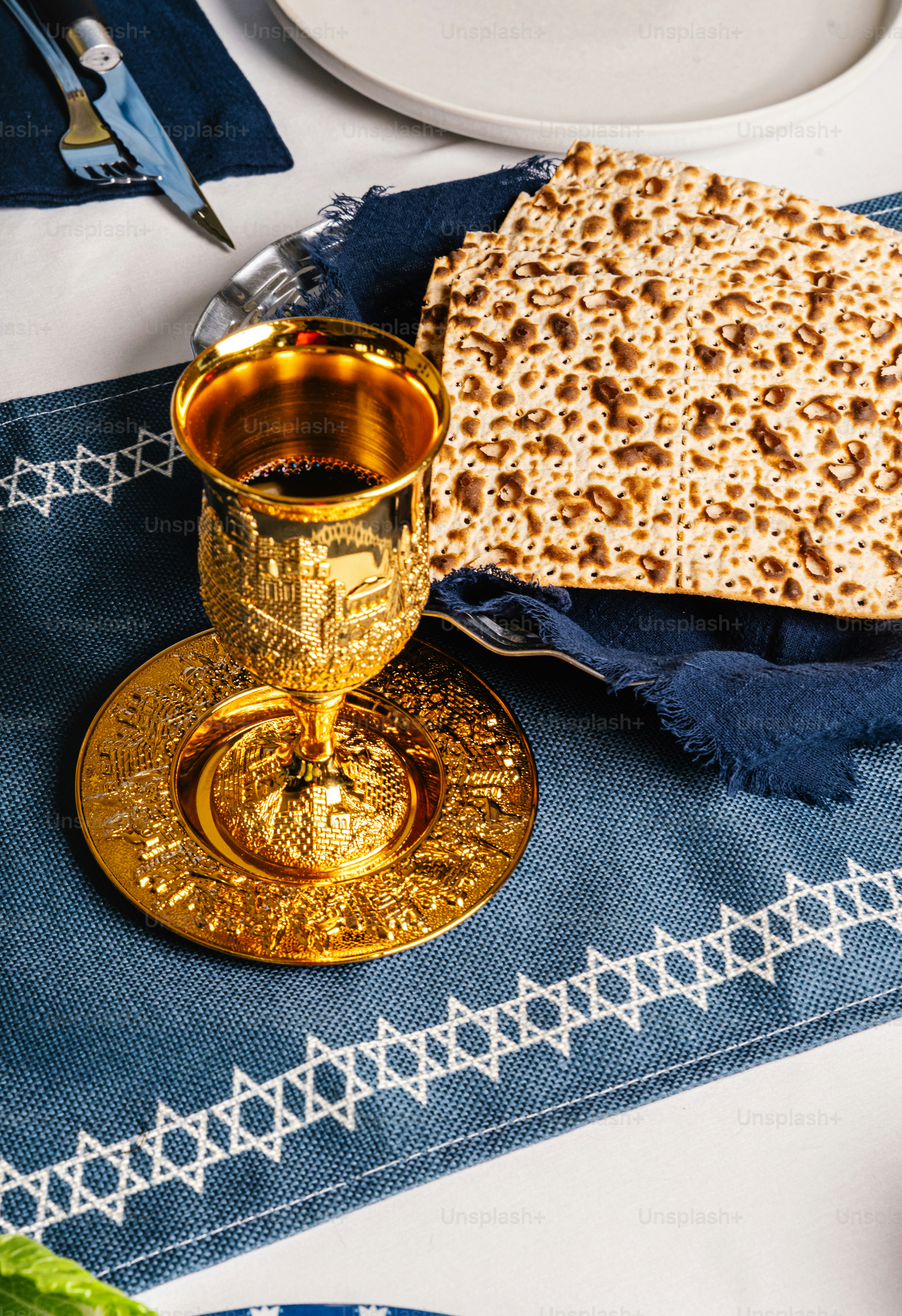Person holding matzah at a seder table photo – Spiritual Image on Unsplash