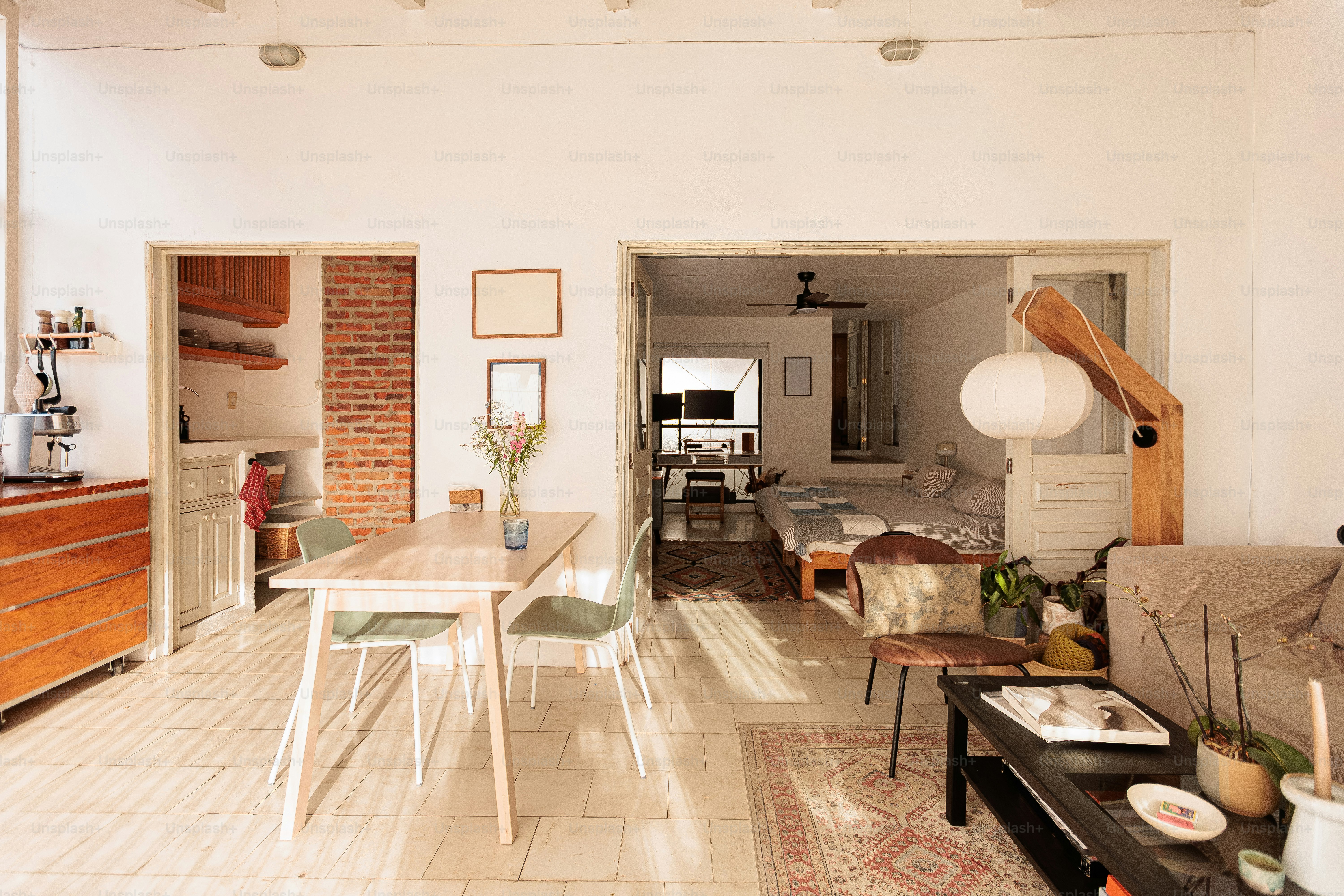 Bright, airy living space with dining and sleeping areas.