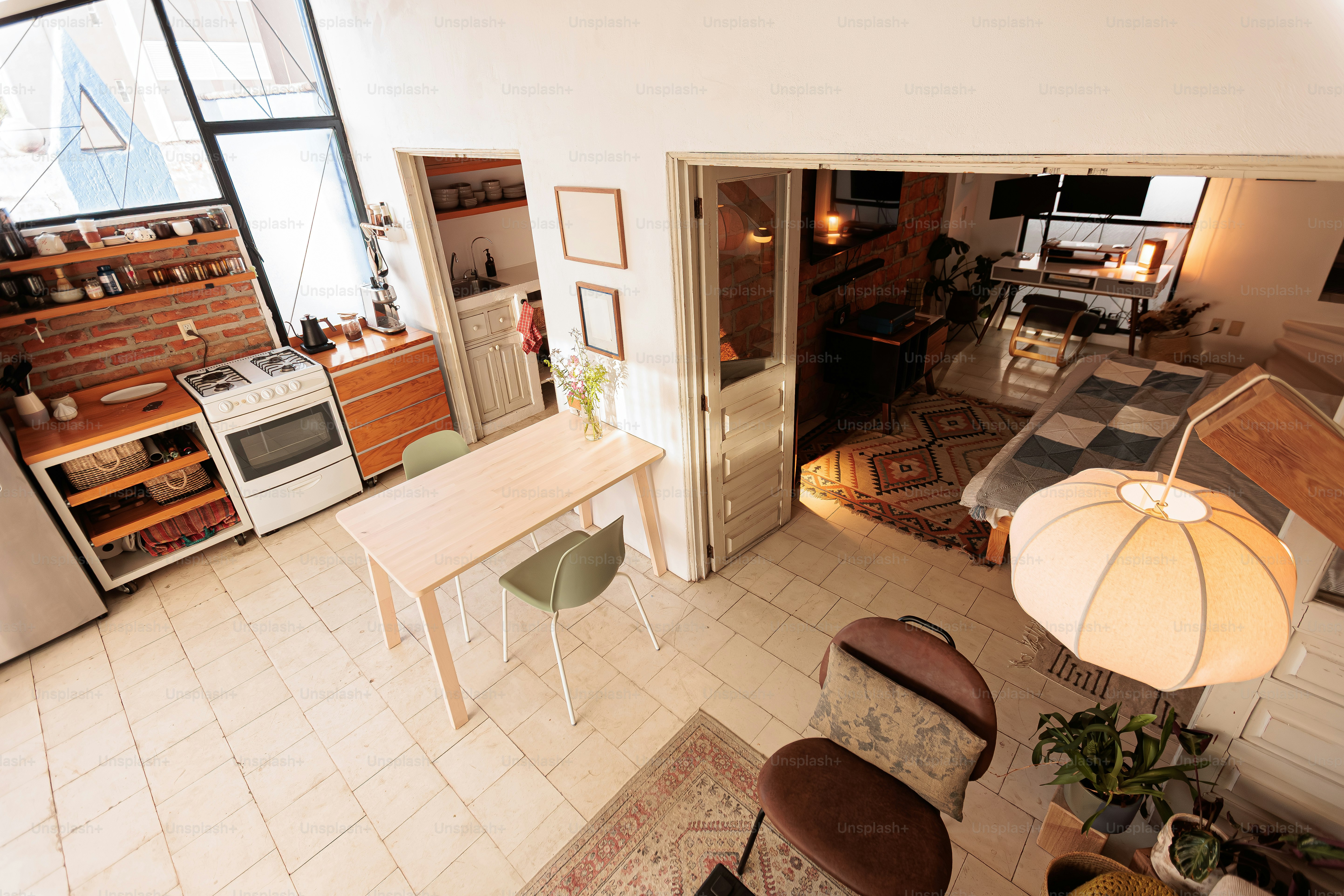 Bright loft apartment interior with dining area and kitchen.