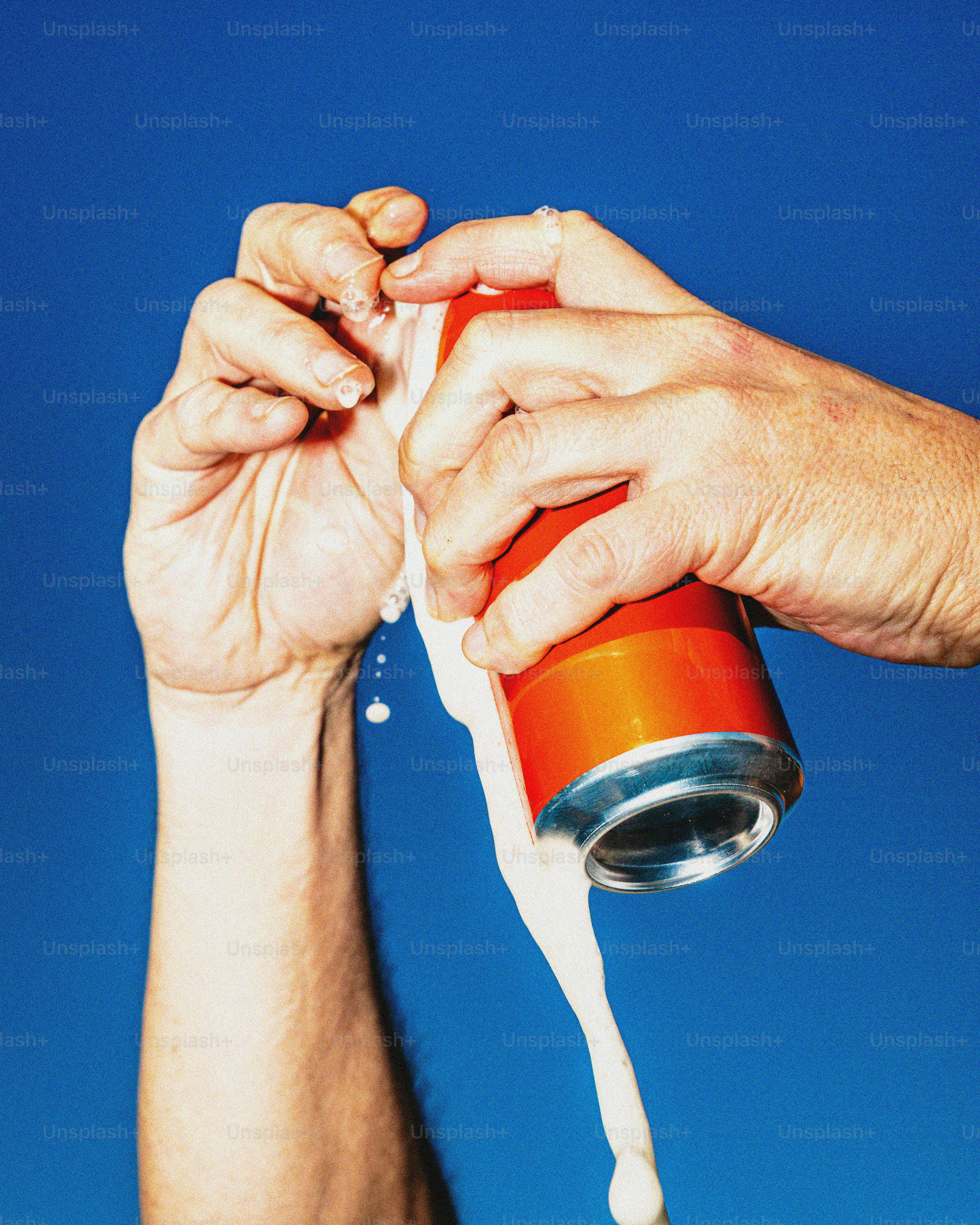 Man opening a can of soda with foam spilling photo – Beer Image on Unsplash