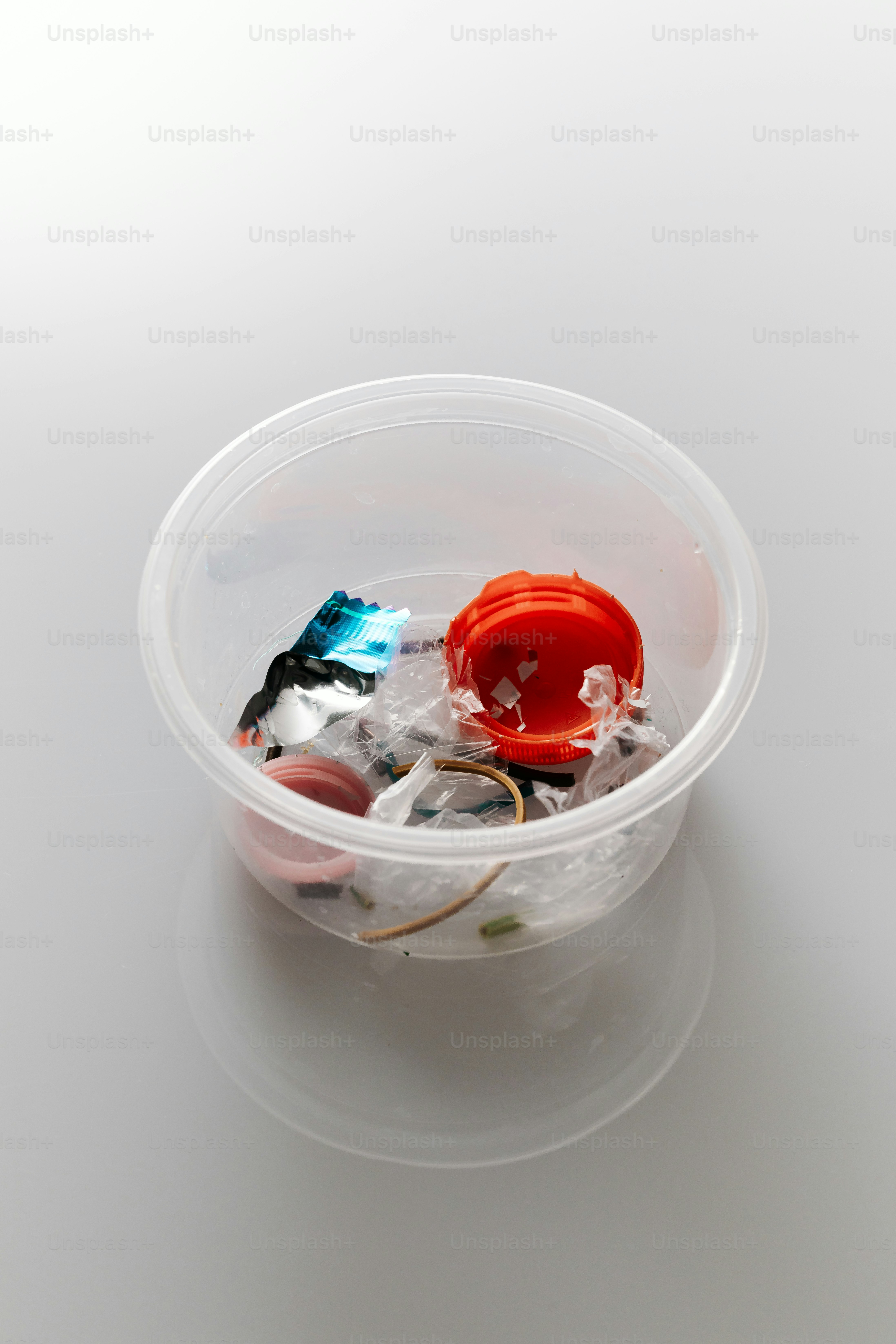 Plastic container filled with various small items