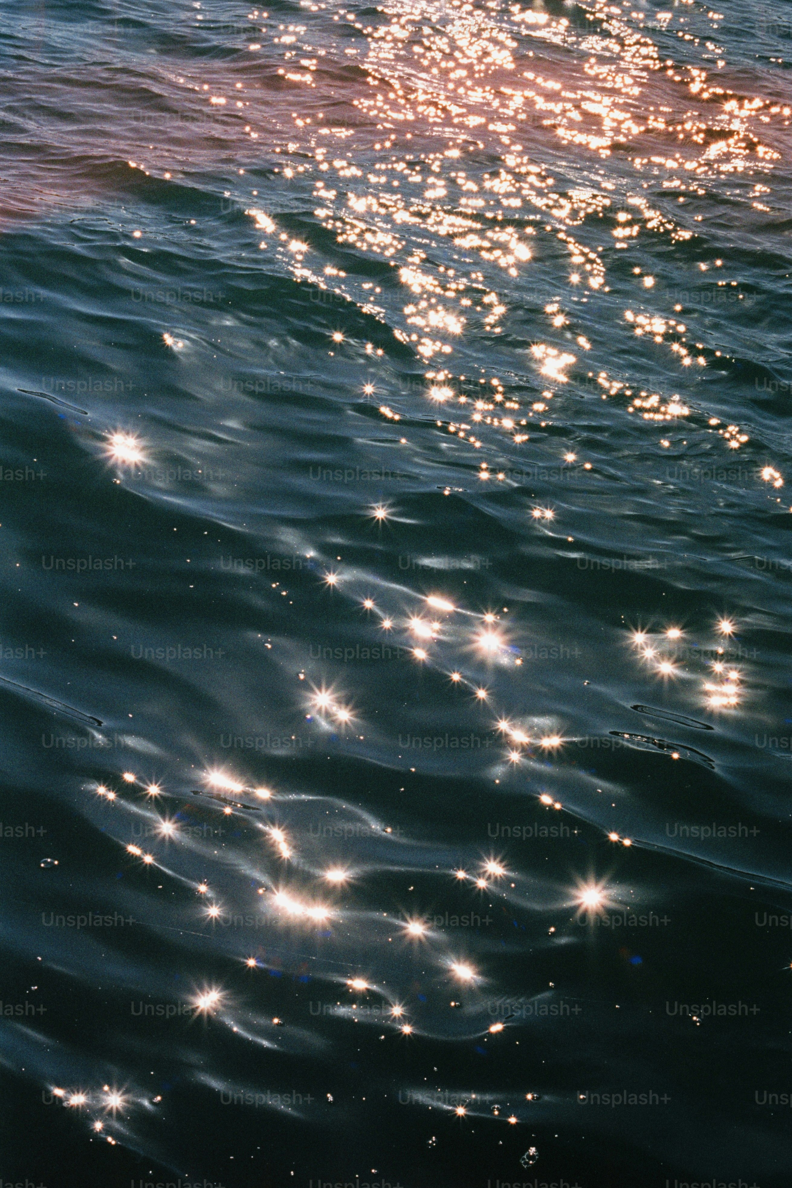 Sparkling sunlight on dark blue ocean waves photo – Background Image on ...