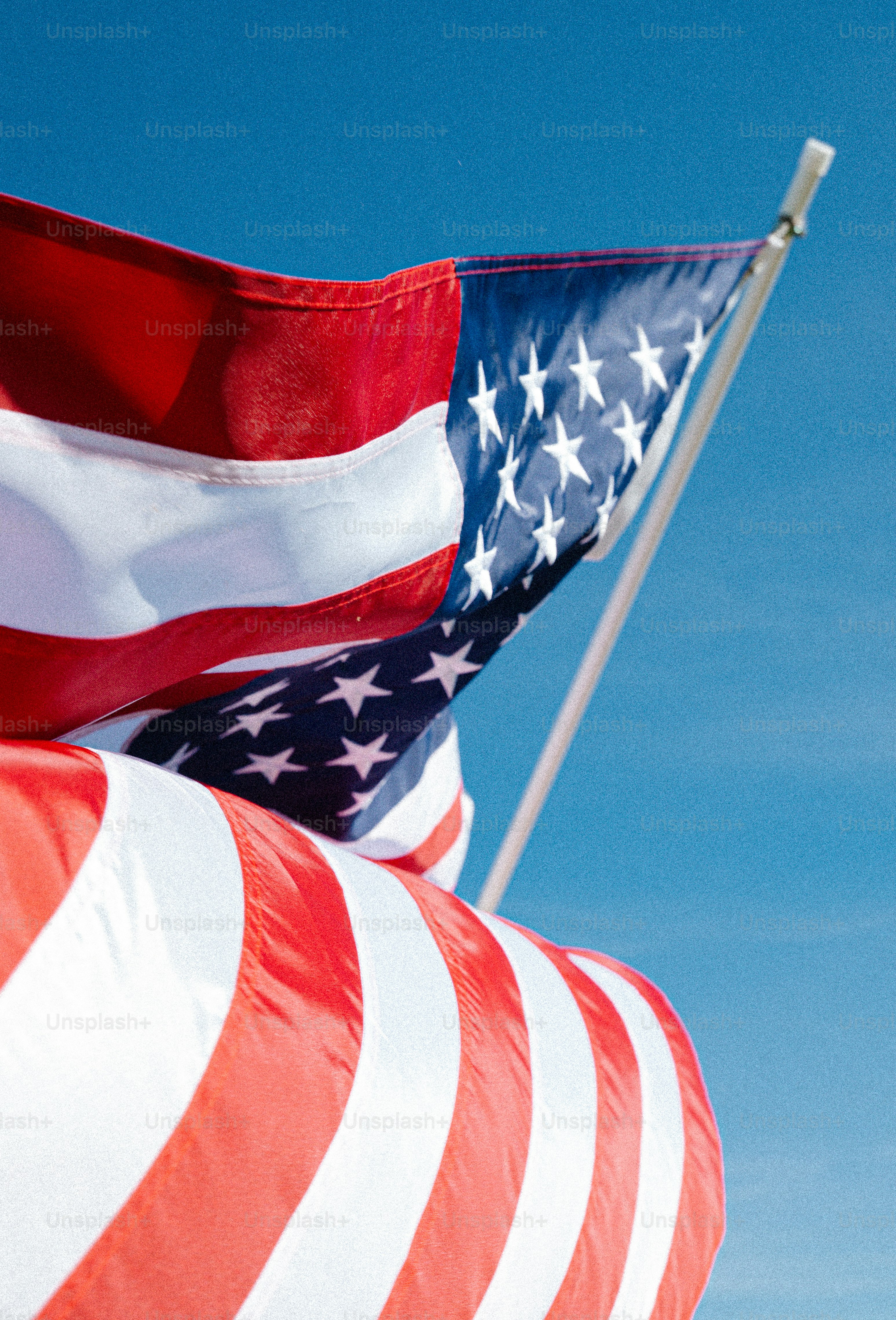 American flag waving against a clear blue sky photo – Blue sky Image on ...