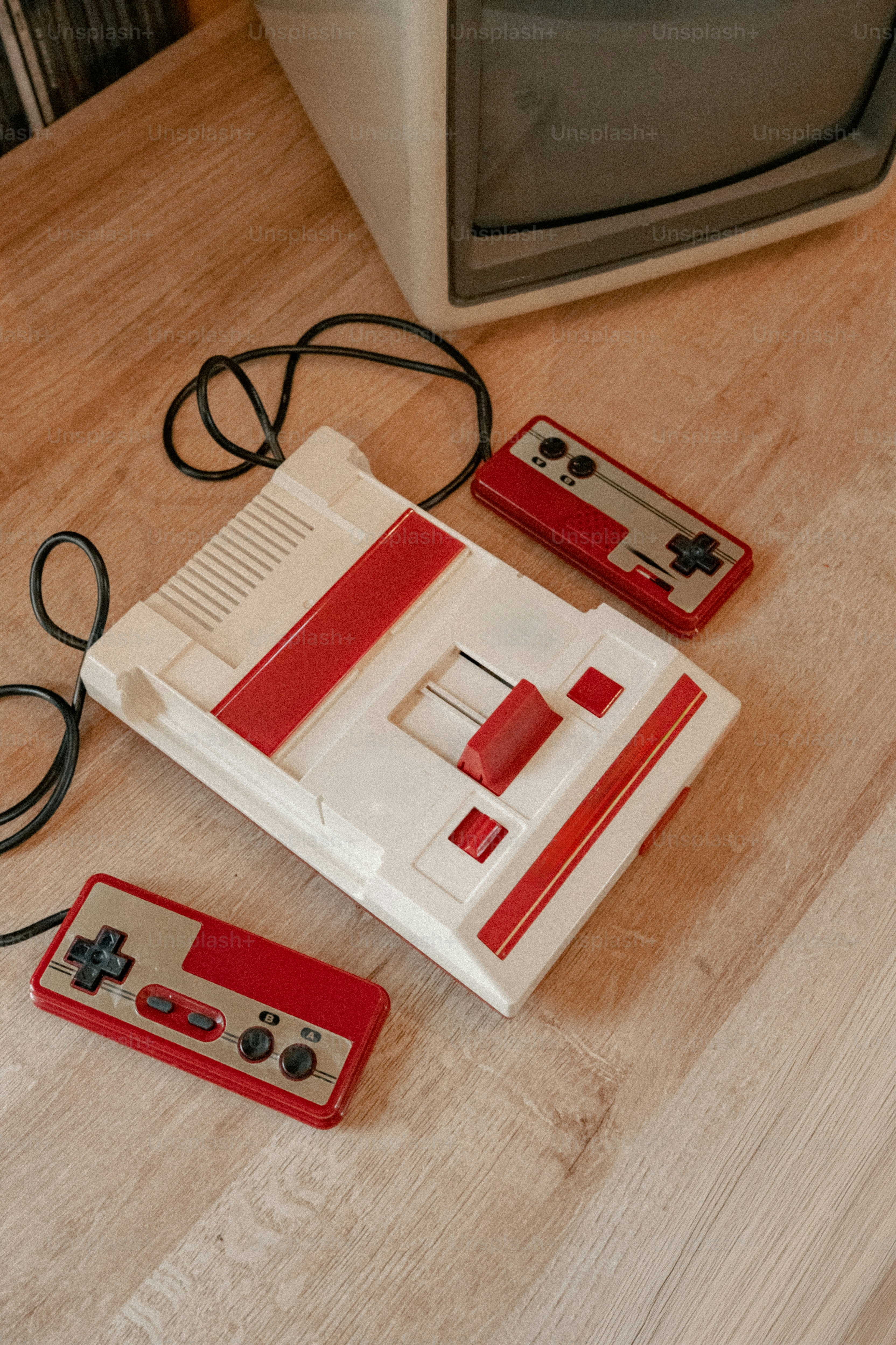Four retro video game controllers on a surface photo – Technology Image ...