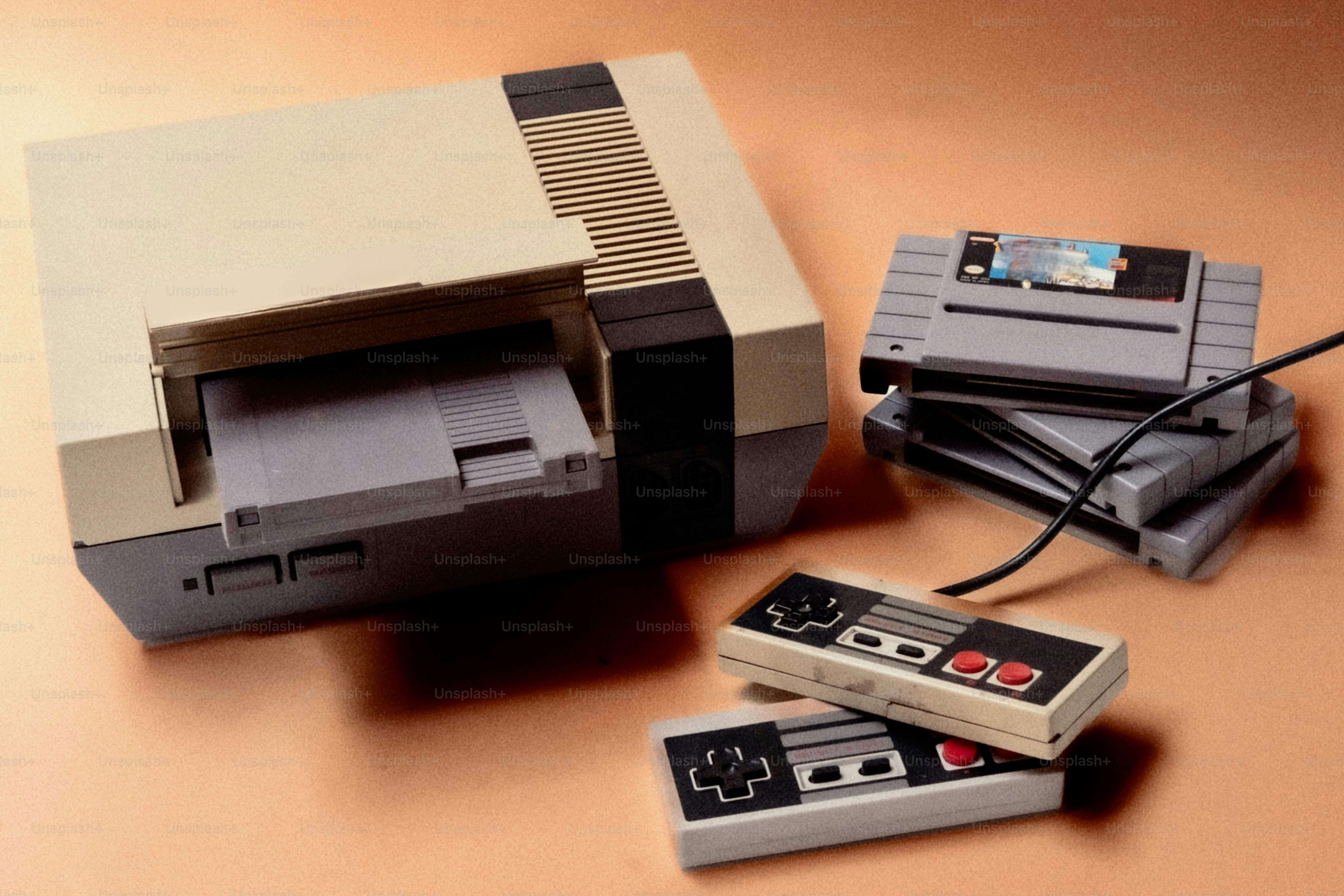 Konsol Nintendo vintage dengan pengontrol dan kartrid