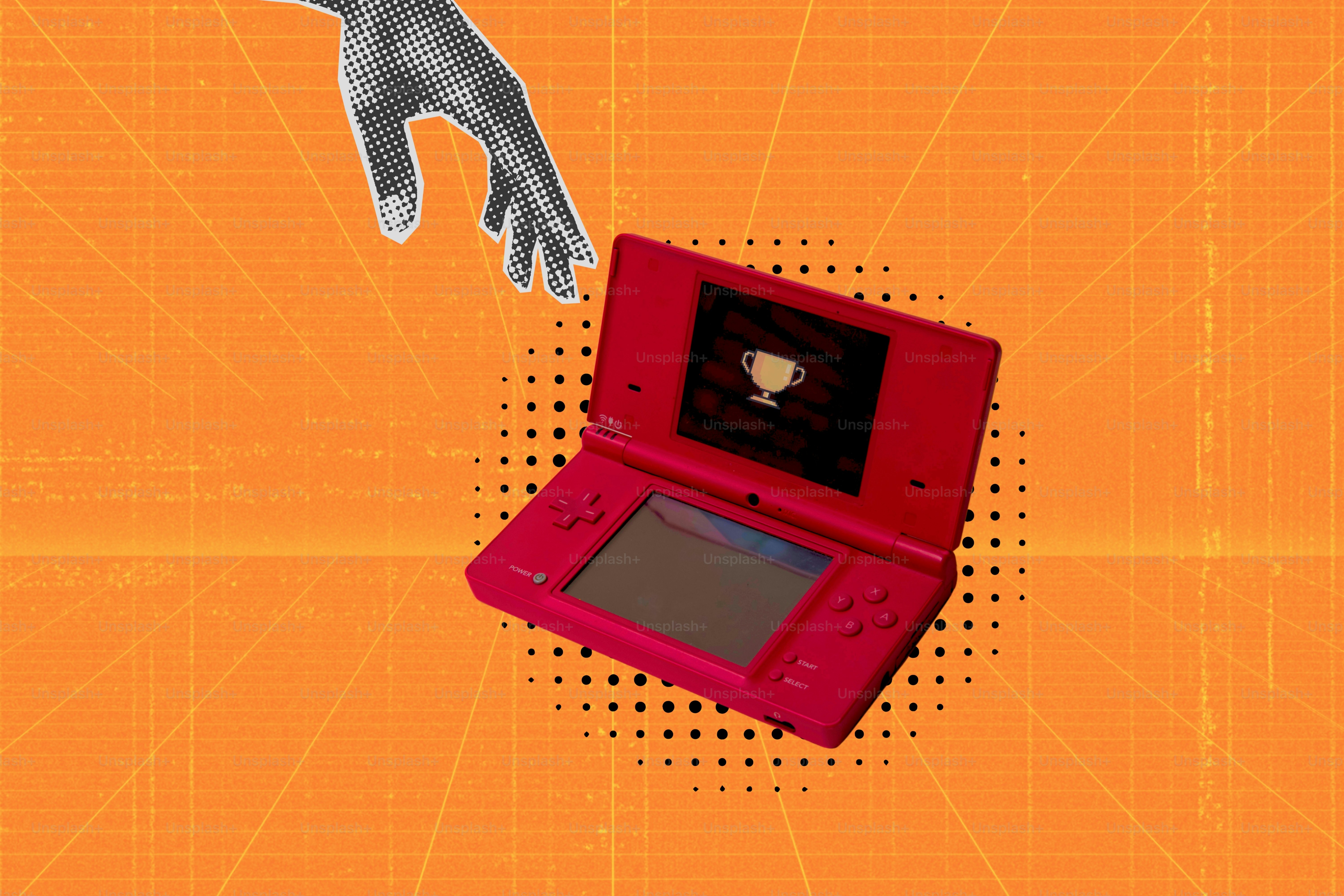 Consola de videojuegos roja con un trofeo en pantalla.