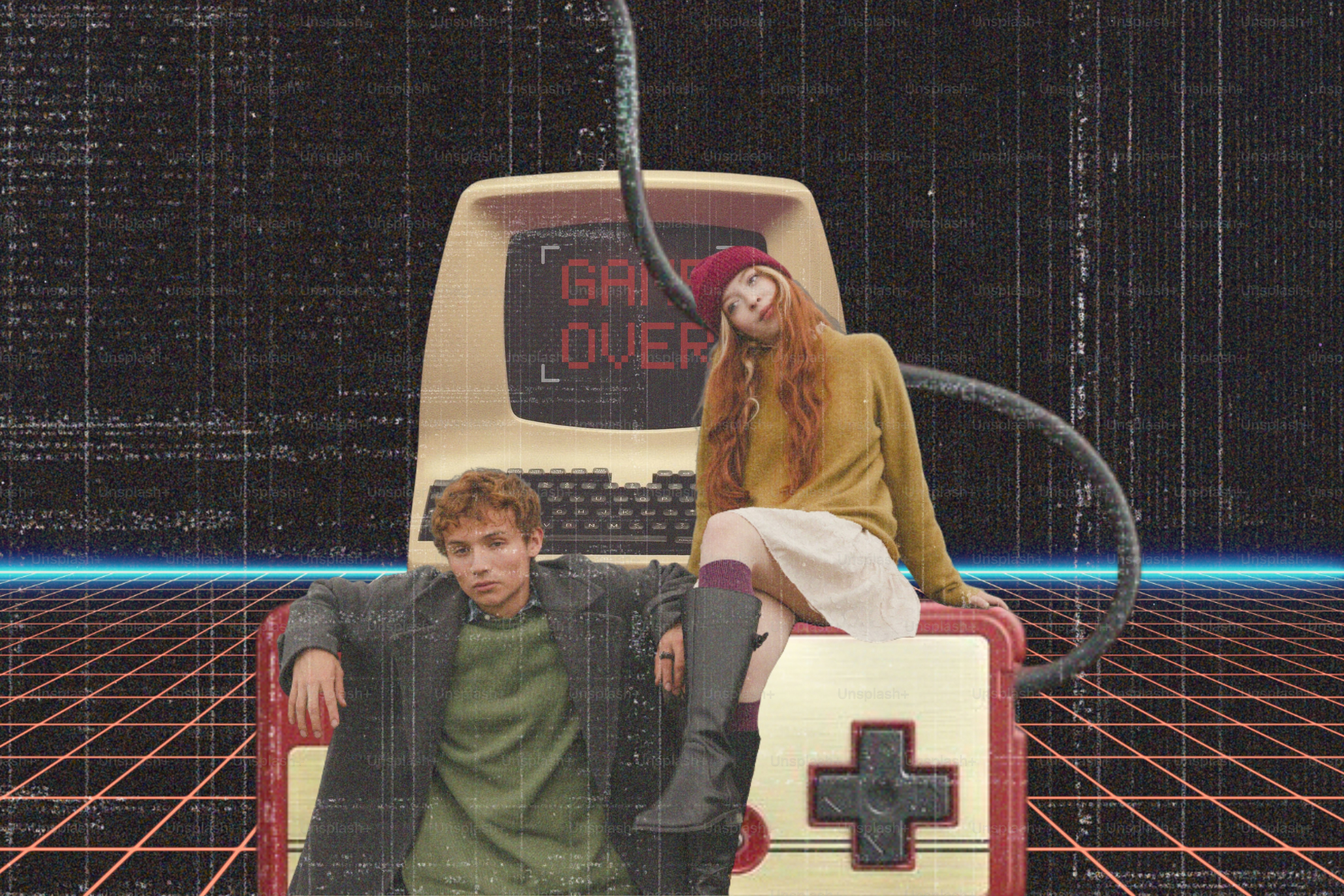 Two people posing with vintage computer and game controller