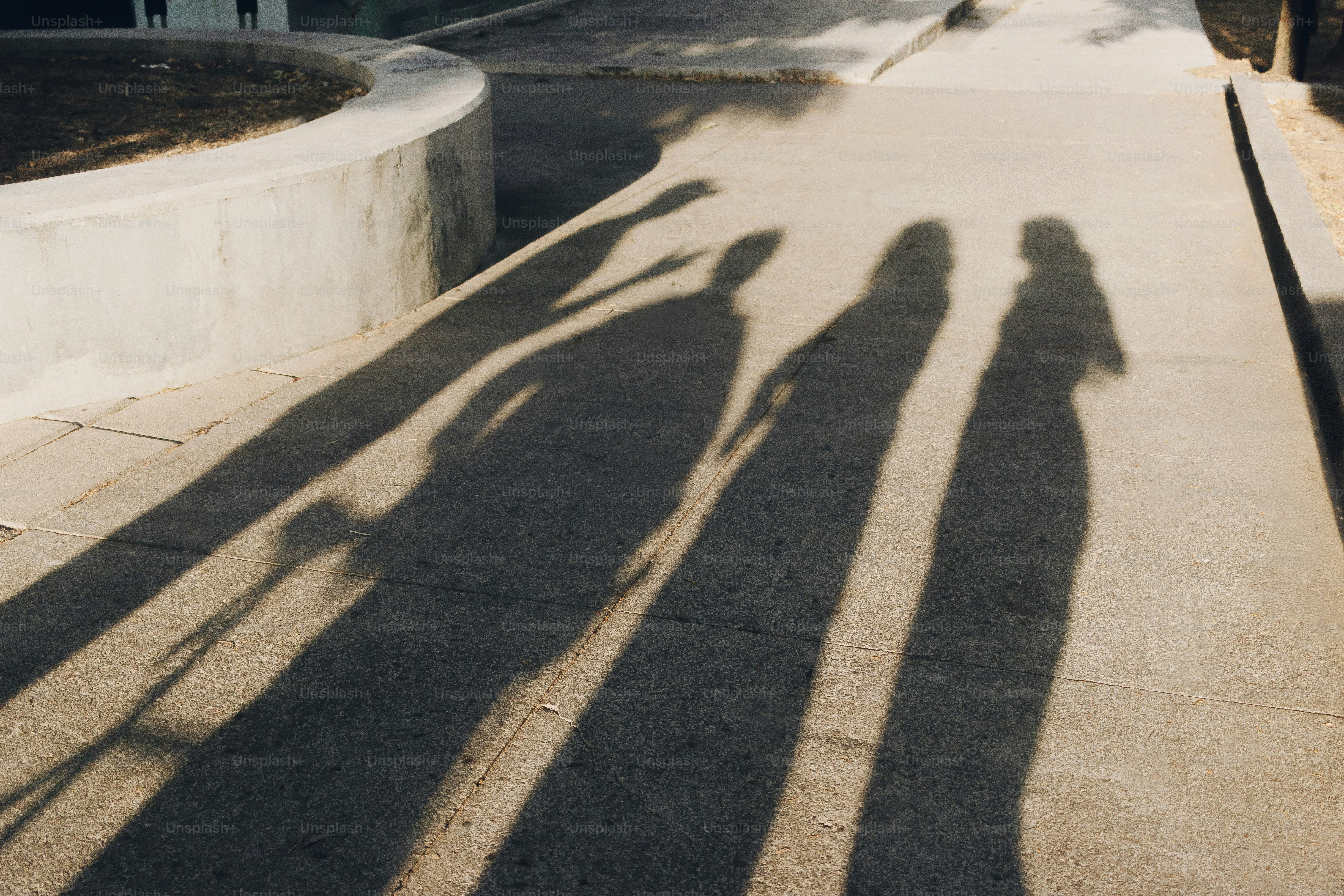 Two shadows of people talking against a wall photo – Abstract Image on ...